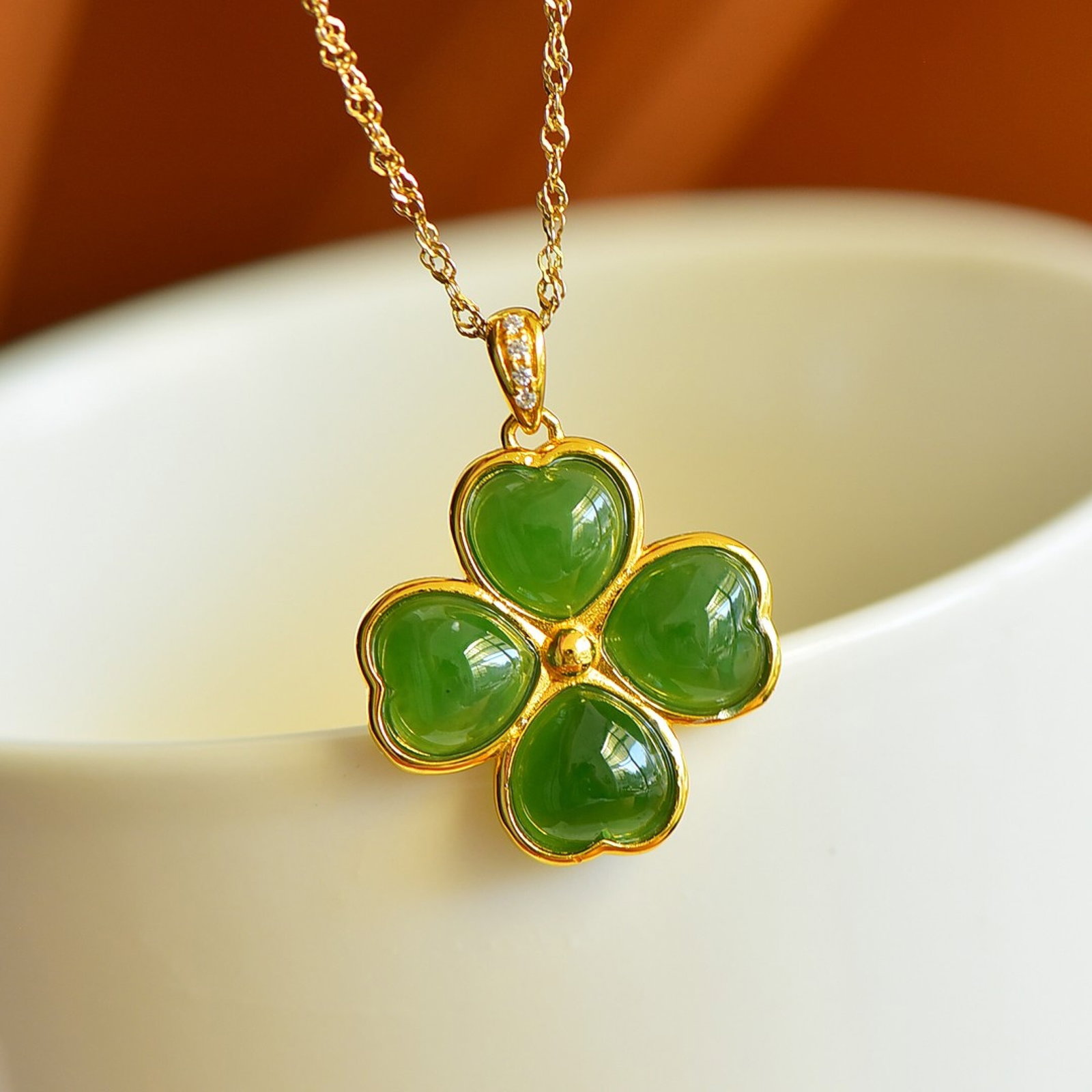An Exquisite Sterling Silver-Gold Plated Inlaid Jasper Pendant: Estimated Value:400-800 An Exquisite Sterling Silver-Gold Plated Inlaid Jasper Pendant,Size:8mmx8mm 纯银镀金镶碧玉吊坠