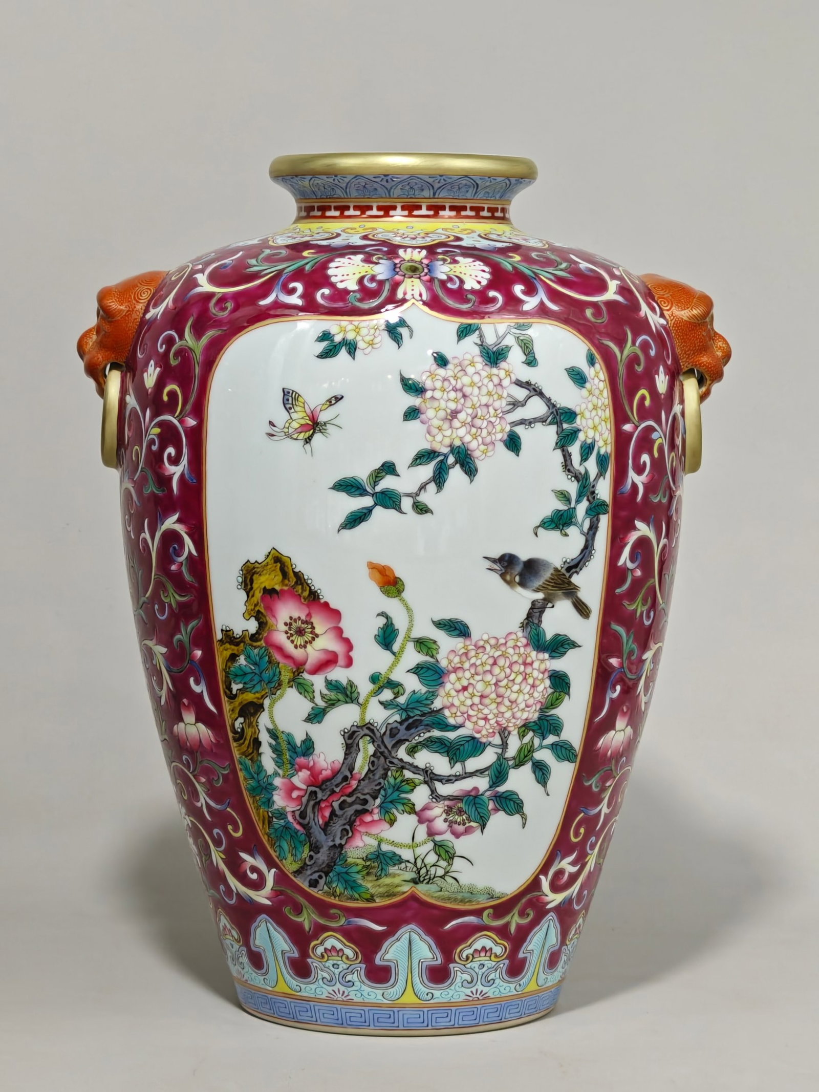 An Exquisite Famille-Rose Ruby Red-Glazed Painted Gold Flower and Bird Pattern Beast-Ears Vase: Estimated Value:4000-8000 An Exquisite Famille-Rose Ruby Red-Glazed Painted Gold Flower and Bird Pattern Beast-Ears Vase,Qing Dynasty,China,Qianlong Six-character Mark,Size:10.6inx8.3in