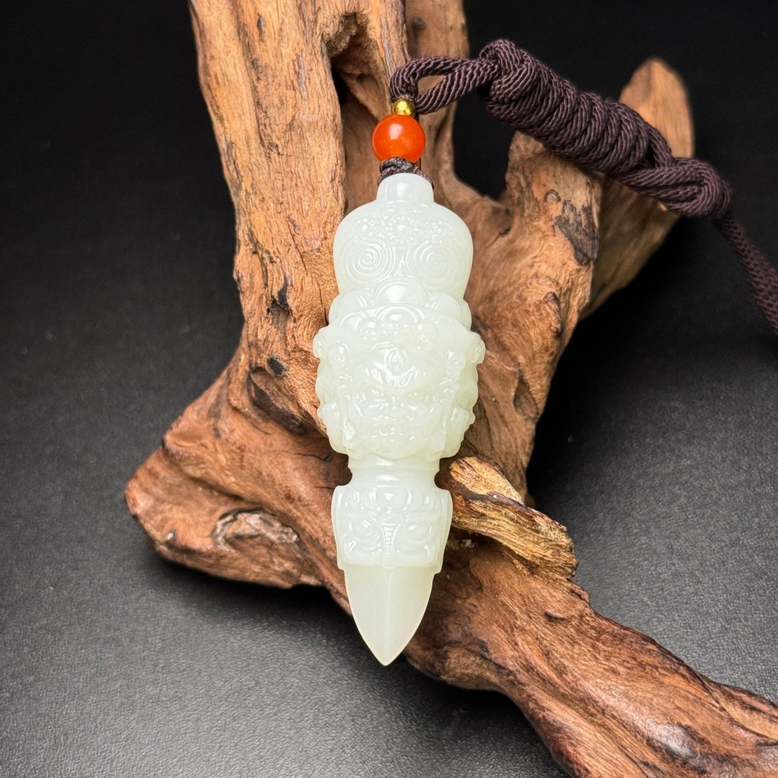 An Exquisite White Jade Beast-Face Pattern Vajry Pestle Pendant: Estimated Value:2000-4000 An Exquisite White Jade Beast-Face Pattern Vajry Pestle Pendant,Qing Dynasty,China,Size:22mmx19mmx63mm,Weight:30g 白玉兽面纹金刚