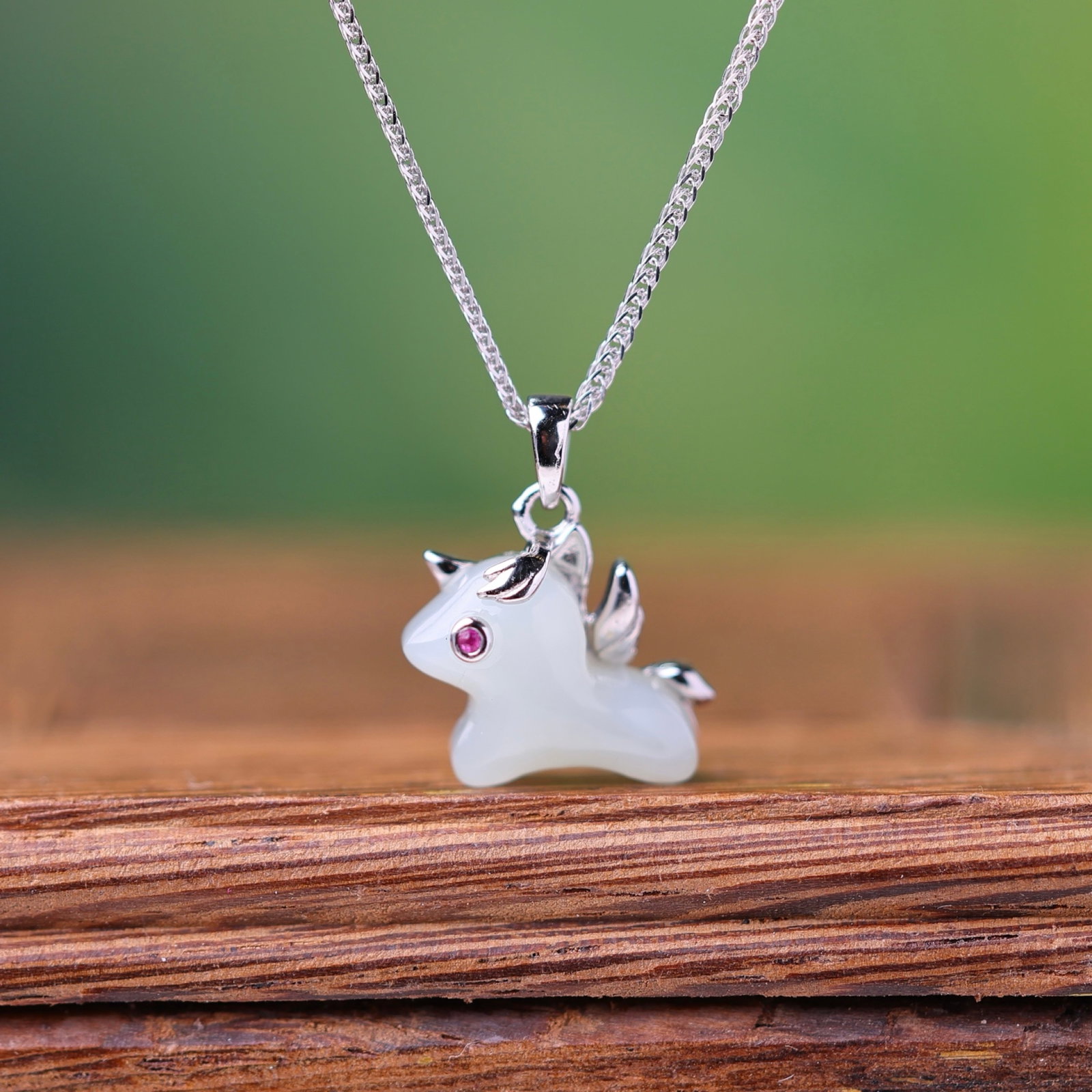 An Exquisite Sterling Silver Inlaid White Jade Pendant: Estimated Value:200-400 An Exquisite Sterling Silver Inlaid White Jade Pendant,Size:10mmx14mm 纯银镶白玉吊坠