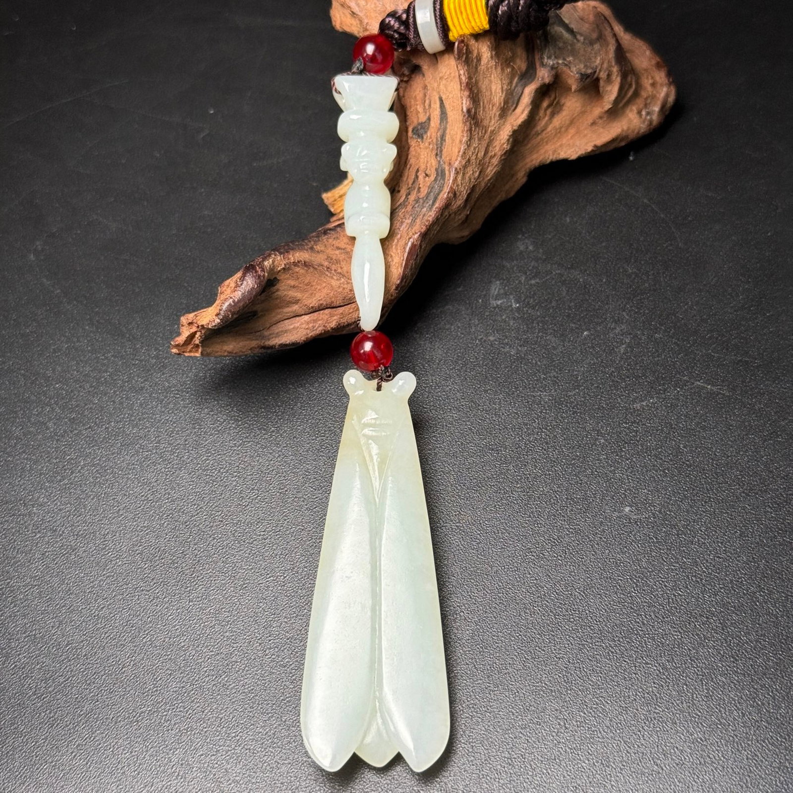 An Exquisite White Jade Cicada Pendant: Estimated Value:360-800 An Exquisite White Jade Cicada Pendant,Qing Dynasty,China,Size:132mmx24mmx10mm,Weight:31g 白玉蝉挂件,中国清代