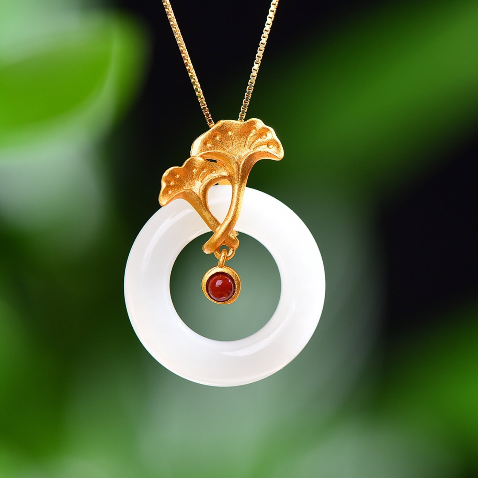 An Exquisite Sterling Silver-Gold Plated Inlaid White Jade Pendant: Estimated Value:400-800 An Exquisite Sterling Silver-Gold Plated Inlaid White Jade Pendant,Size:22mmx22mm 纯银镀金镶白玉吊坠