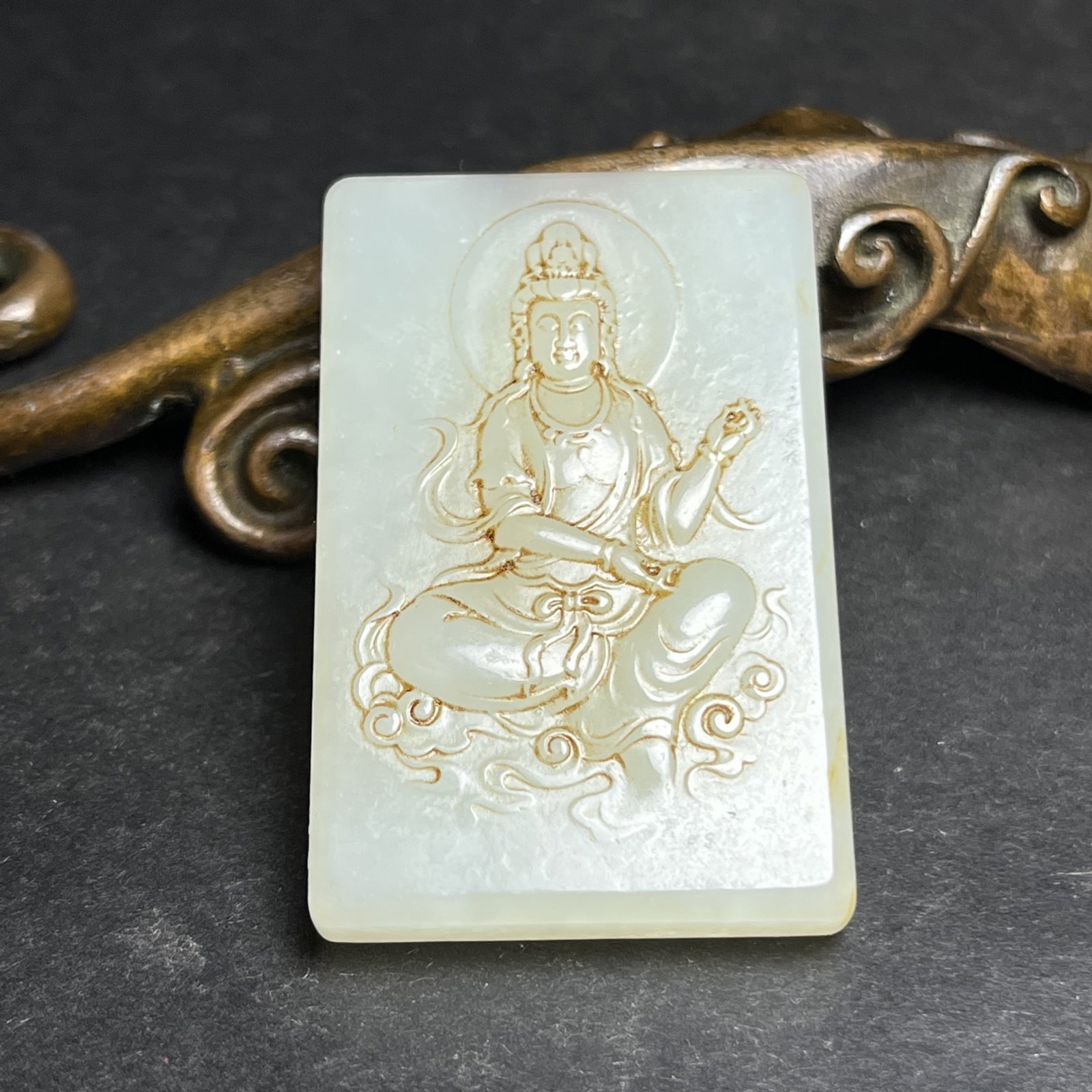 An Exquisite White Jade Statue of Avalokitesvara Pattern Pendant: Estimated Value:600-1200 An Exquisite White Jade Statue of Avalokitesvara Pattern Pendant,Qing Dynasty,China,Size:30mmx8mmx47mm,Weight:27g