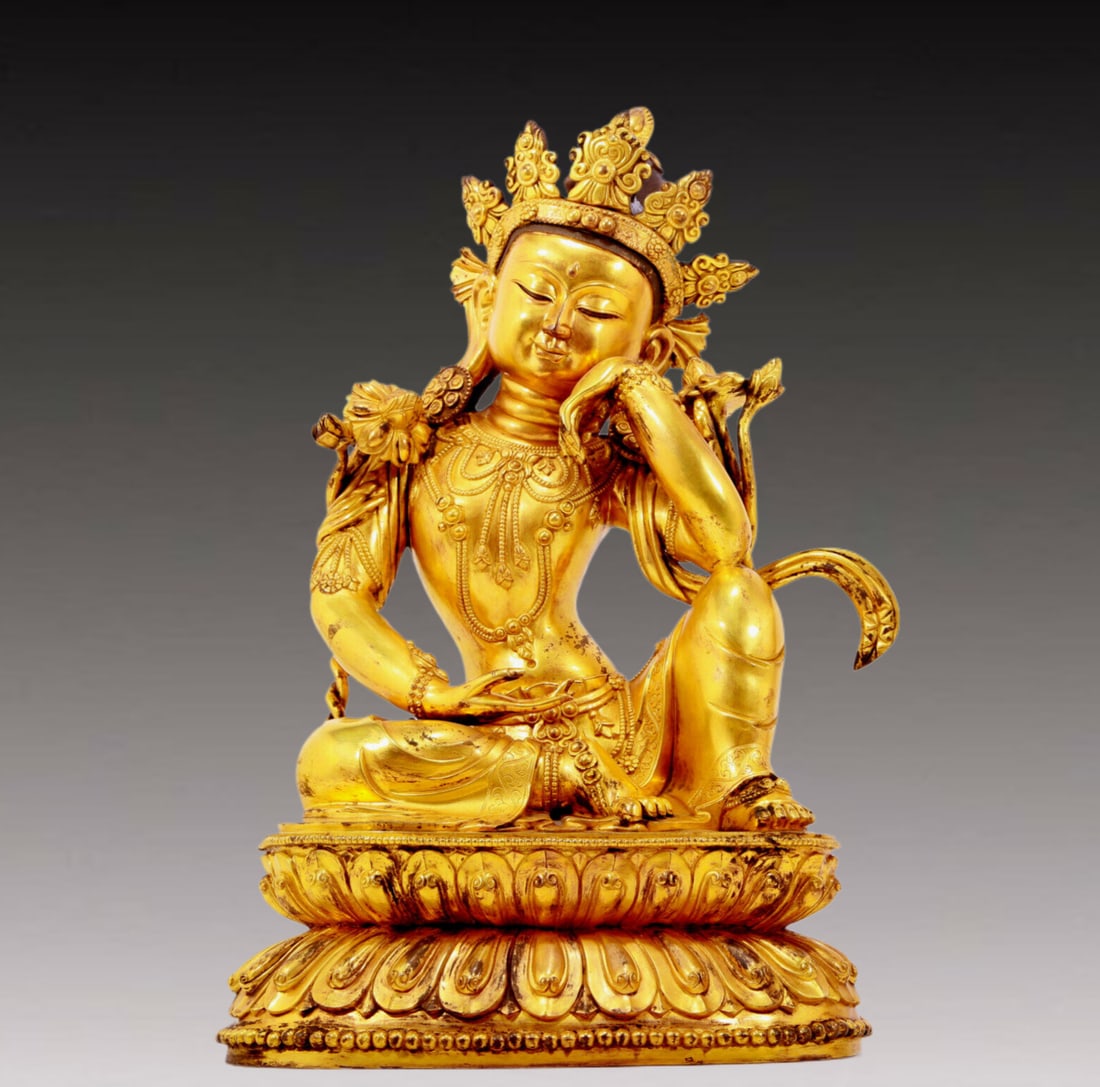 A solemn gilt bronze statue of Guanyin: Estimated Value:11000-22000 A solemn gilt bronze statue of Guanyin, Yongle six-character inscription, Ming Dynasty, China. Guanyin has a graceful posture and an expression of compassion and wisdom.