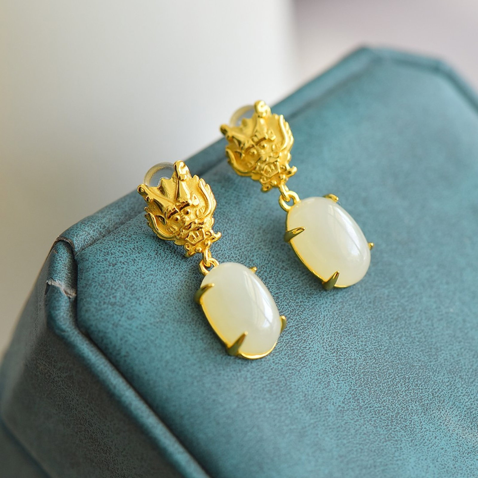 A Pair of Exquisite Sterling Silver-Gold Plated Inlaid White Jade Earrings: Estimated Value:200-400 A Pair of Exquisite Sterling Silver-Gold Plated Inlaid White Jade Earrings,Size:8mmx12mm 一对纯银镀金镶白玉耳环