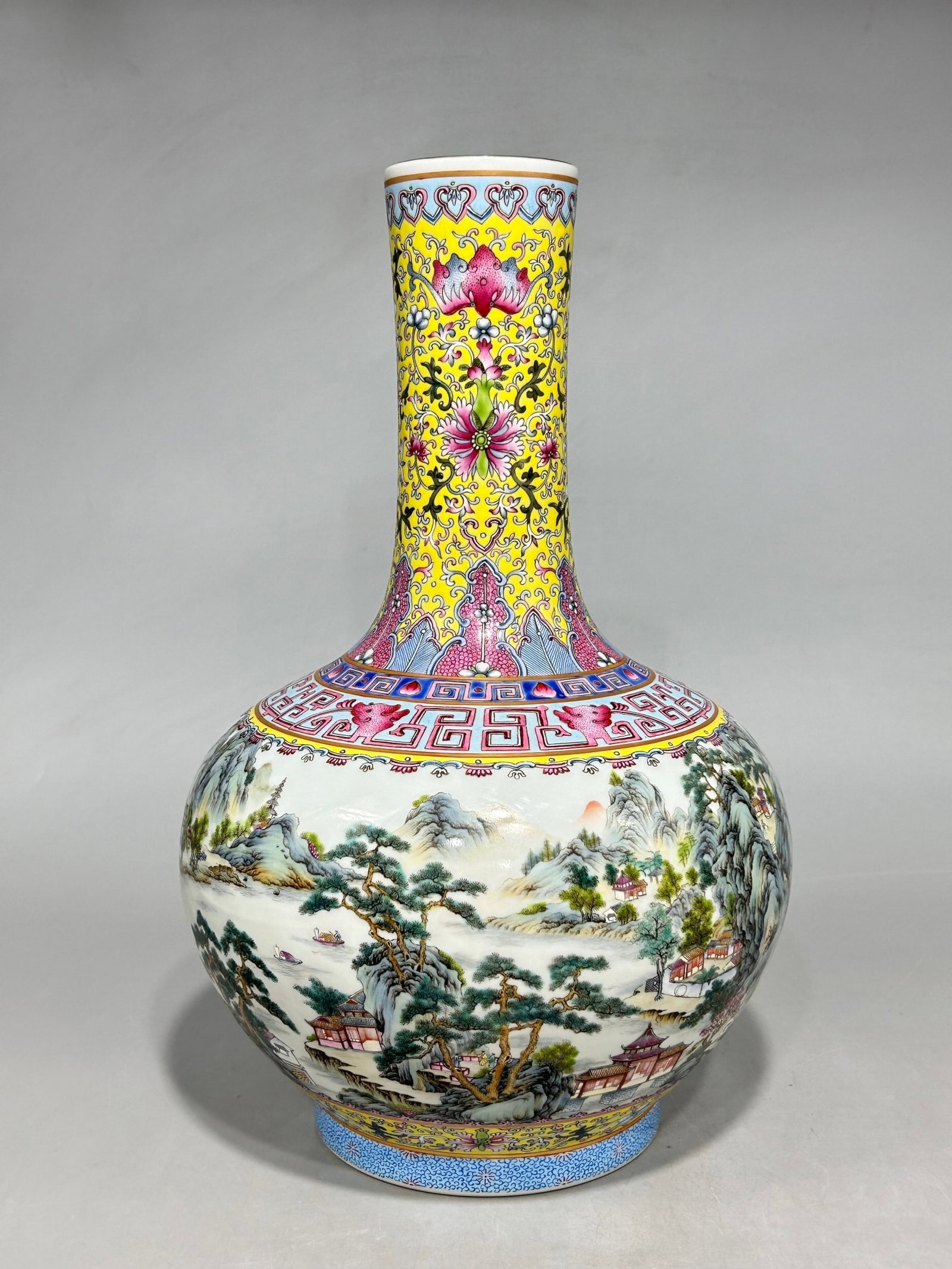 A Huge Famille-Rose Yellow Ground Painted Gold Landscape Pattern Vase: Estimated Value:6000-12000 A Huge Famille-Rose Yellow Ground Painted Gold Landscape Pattern Vase,Qing Dynasty,China,Qianlong Six-character Mark,Size:15.7inx9.8in