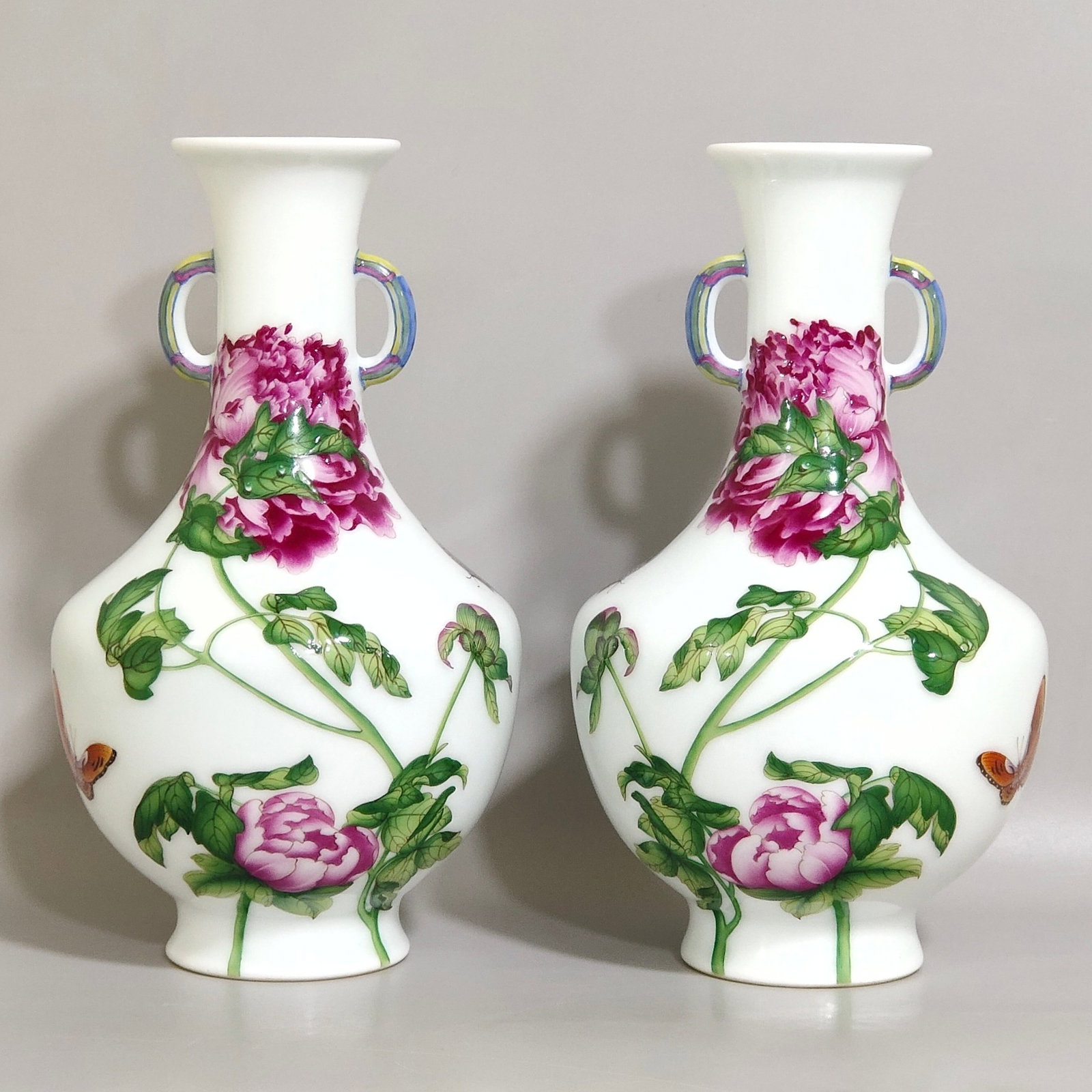 A Pair of Exquisite Enamel Flower and Butterfly Pattern Double-Ears Vases,With Poem: Estimated Value:2400-4800 A Pair of Exquisite Enamel Flower and Butterfly Pattern Double-Ears Vases,With Poem,Qing Dynasty,China,Qianlong Four-character Mark,Size:6.3inx3.3in 一对珐&