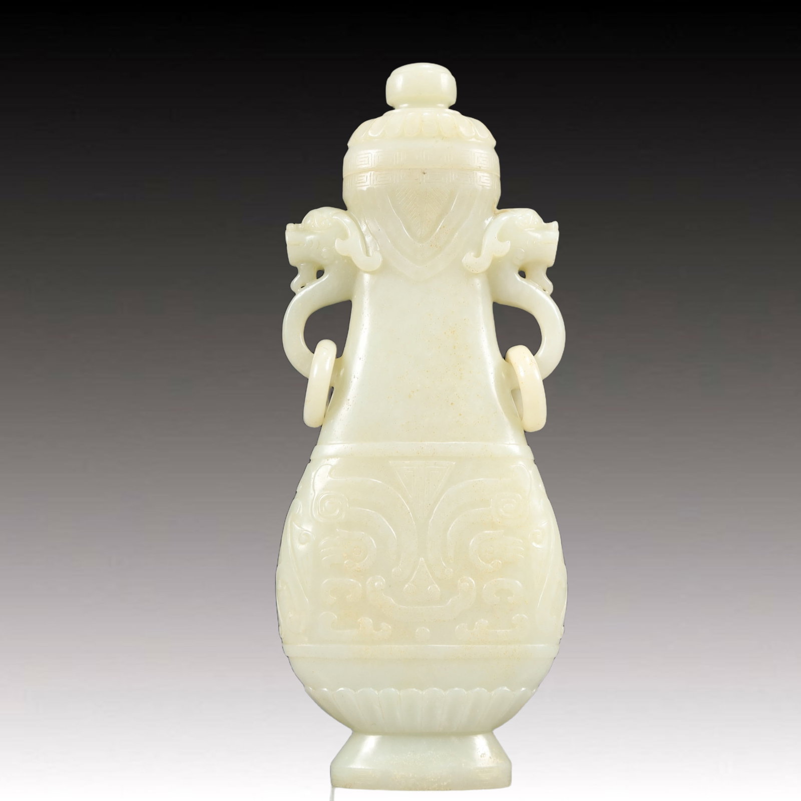 An Exquisite White Jade Beast-Face Pattern Dragon-Ears Bottle: Estimated Value:16000-32000 An Exquisite White Jade Beast-Face Pattern Dragon-Ears Bottle,Qing Dynasty, China,Size:2.8inx1inx7.5in,Weight:350g