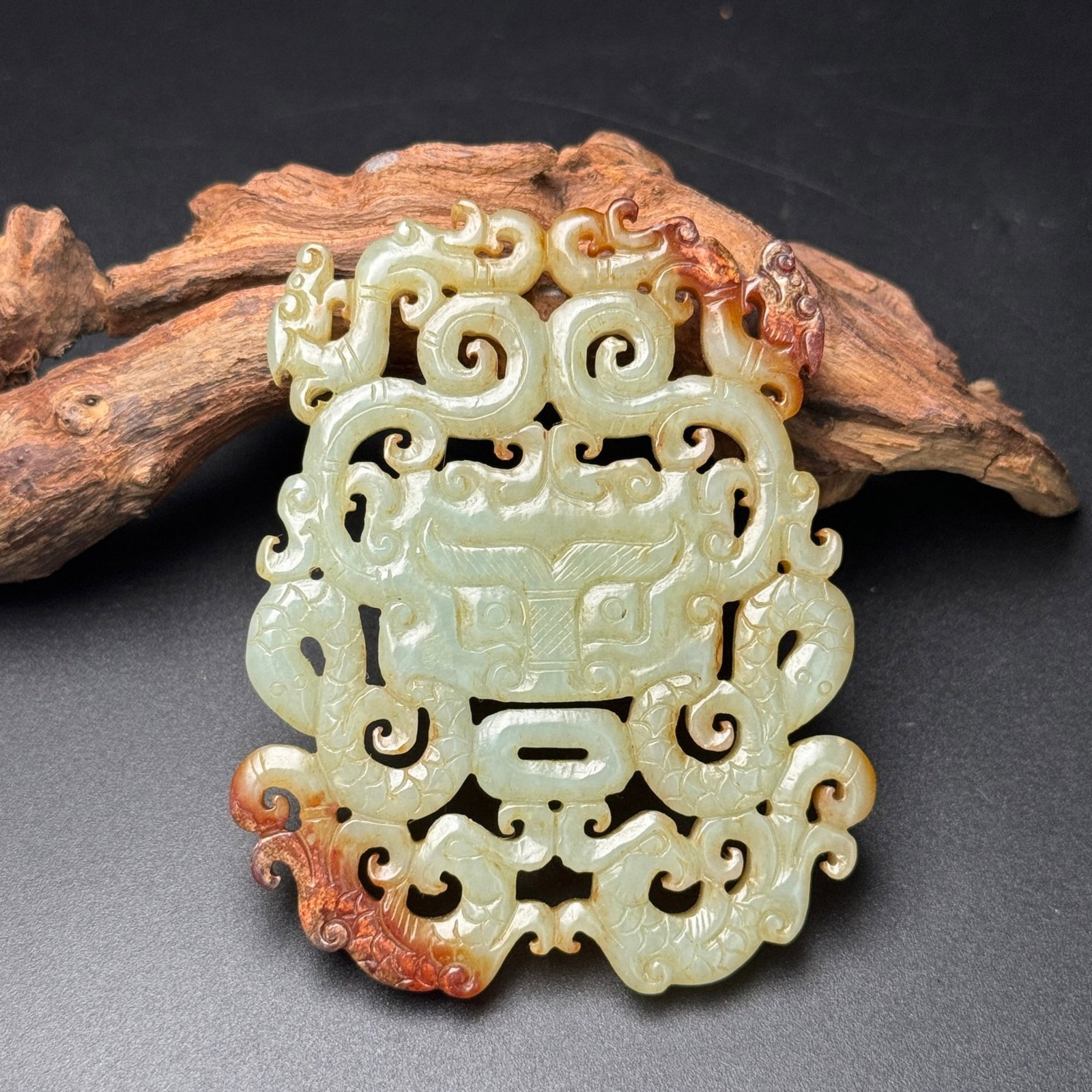 An Exquisite Archaic Jade Beast-Face and Dragon Pattern Pendant: Estimated Value:360-800 An Exquisite Archaic Jade Beast-Face and Dragon Pattern Pendant,Ancient Time,China,Size:79mmx64mmx6.5mm,Weight:61g