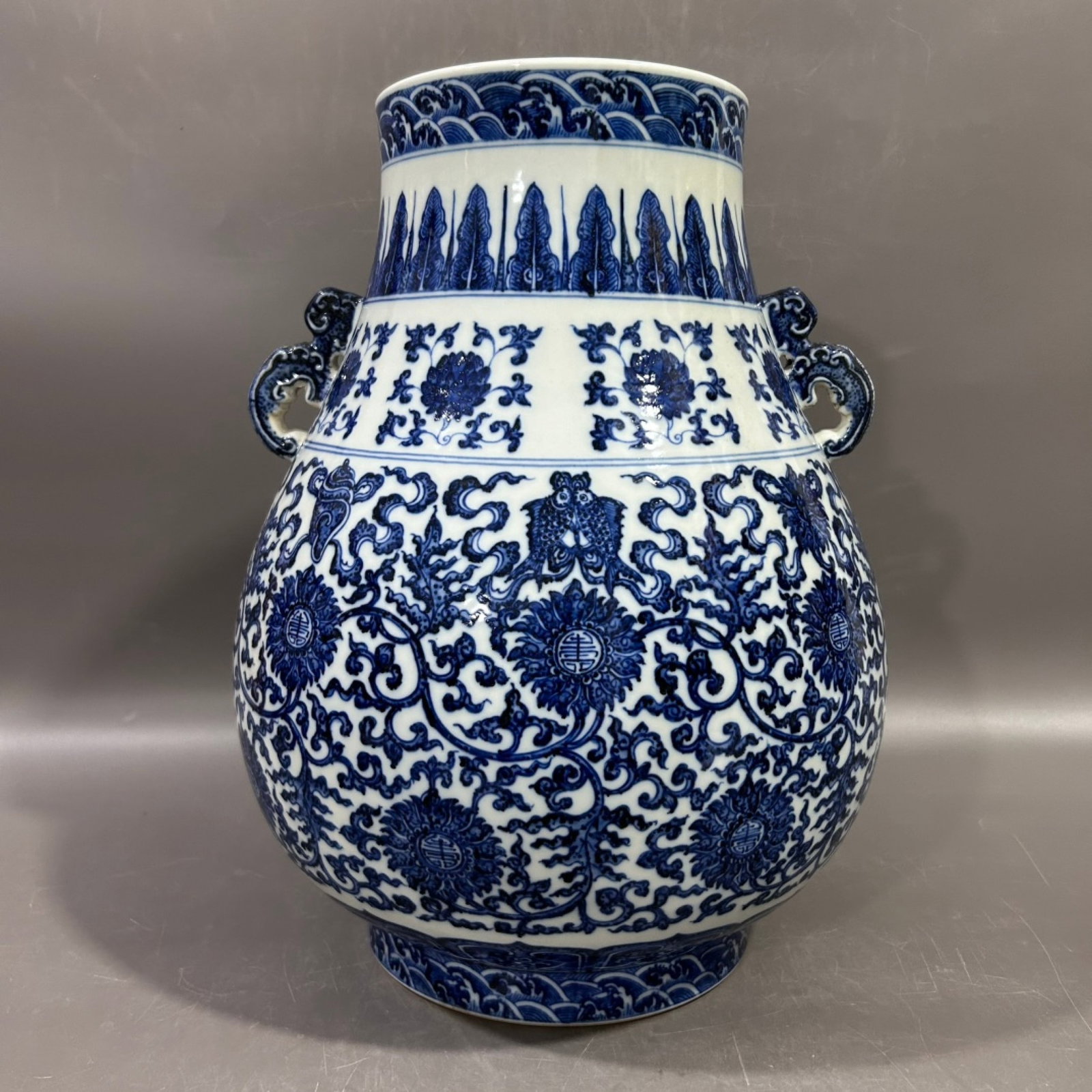 A Rare Blue and White Lotus and Eight Treasures Pattern Double-Ears Vase: Estimated Value:3200-6400 A Rare Blue and White Lotus and Eight Treasures Pattern Double-Ears Vase,Qing Dynasty,China,Qianlong Six-character Mark,Size:8.3inx13.6in