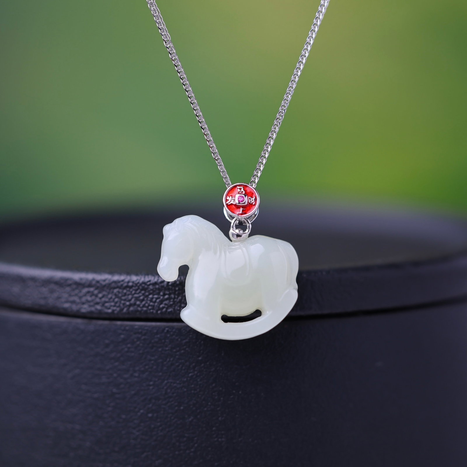 An Exquisite Sterling Silver Inlaid White Jade Pendant: Estimated Value:200-400 An Exquisite Sterling Silver Inlaid White Jade Pendant,Size:19mmx21mm 纯银镶白玉吊坠