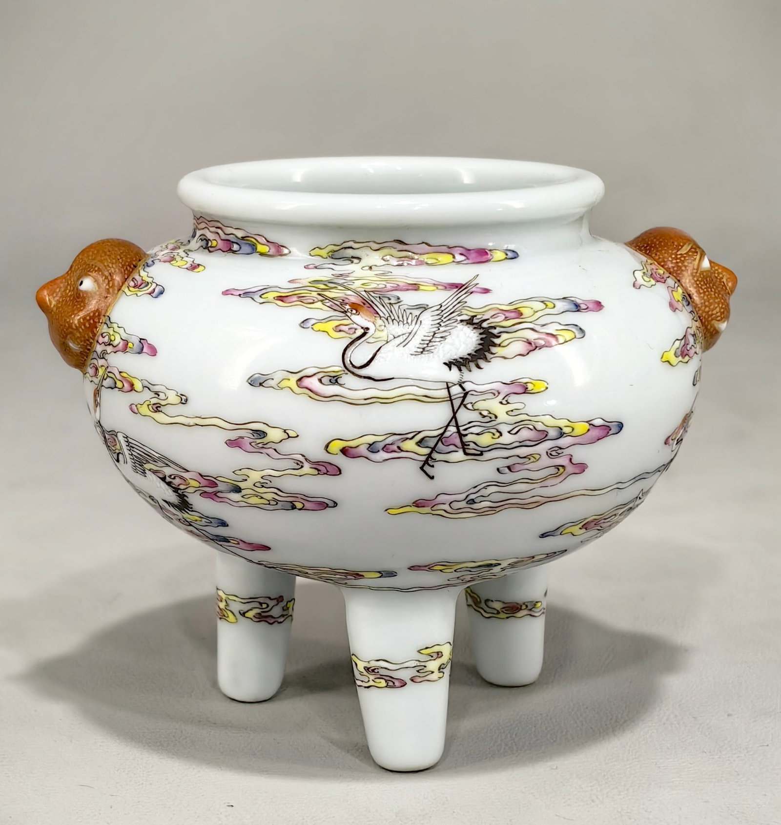An Exquisite Famille-Rose Auspicious Cloud and Crane Pattern Beast-Ears Tripod Censer: Estimated Value:3000-6000 An Exquisite Famille-Rose Auspicious Cloud and Crane Pattern Beast-Ears Tripod Censer,Qing Dynasty,China,Qianlong Six-character Mark,Size:3.3inx4.1in