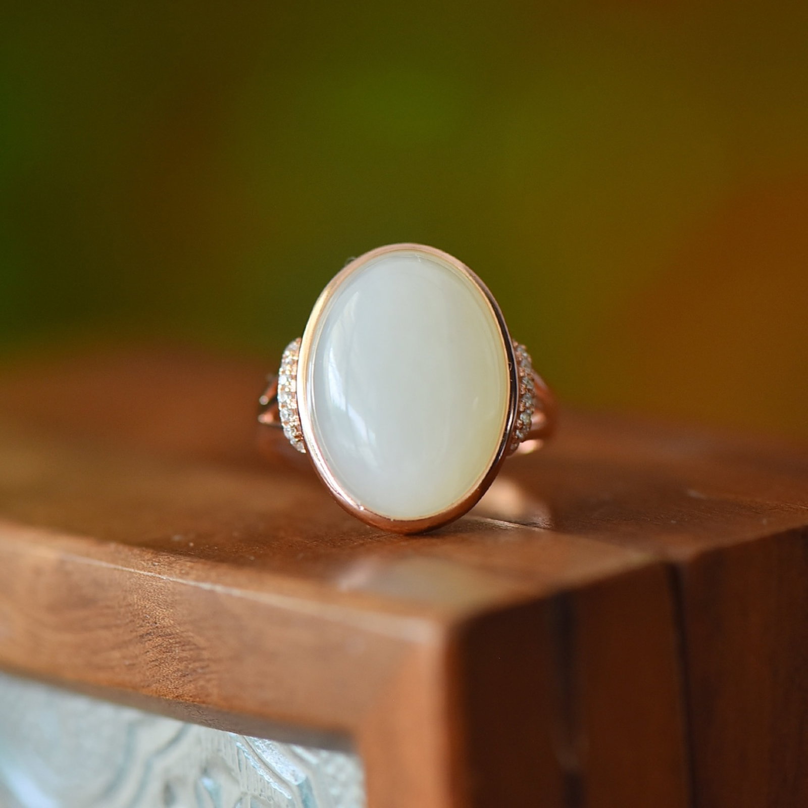 An Exquisite Sterling Silver-Gold Plated Inlaid White Jade Ring: Estimated Value:200-400 An Exquisite Sterling Silver-Gold Plated Inlaid White Jade Ring,Size:13mmx18mm 纯银镀金镶白玉戒指