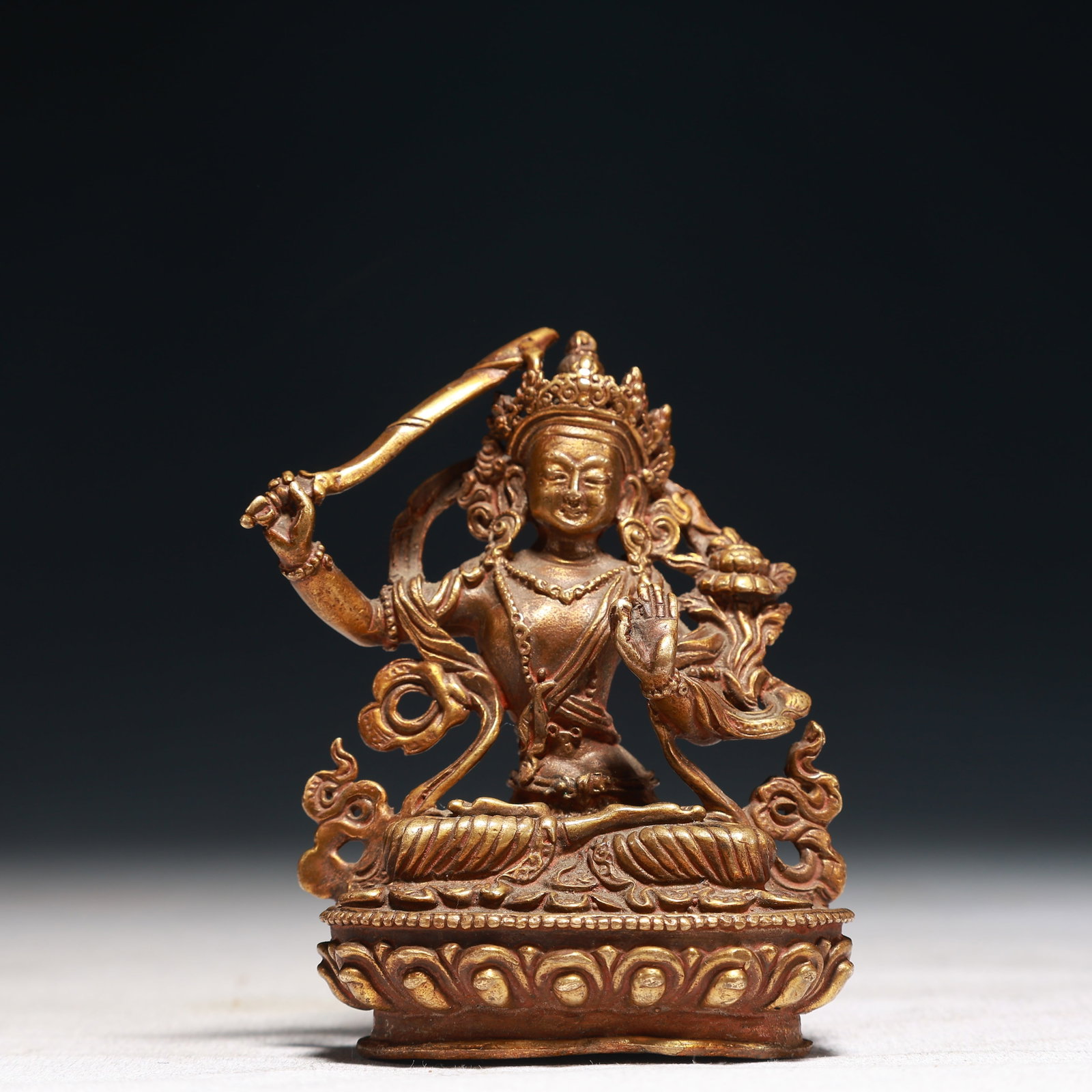 A Solemn Gilt Bronze Statue of Manjusri: Estimated Value:1100-2200 A Solemn Gilt Bronze Statue of Manjusri,Qing Dynasty,China,Size:2.4inx1.6inx3.1in,Weight:200g