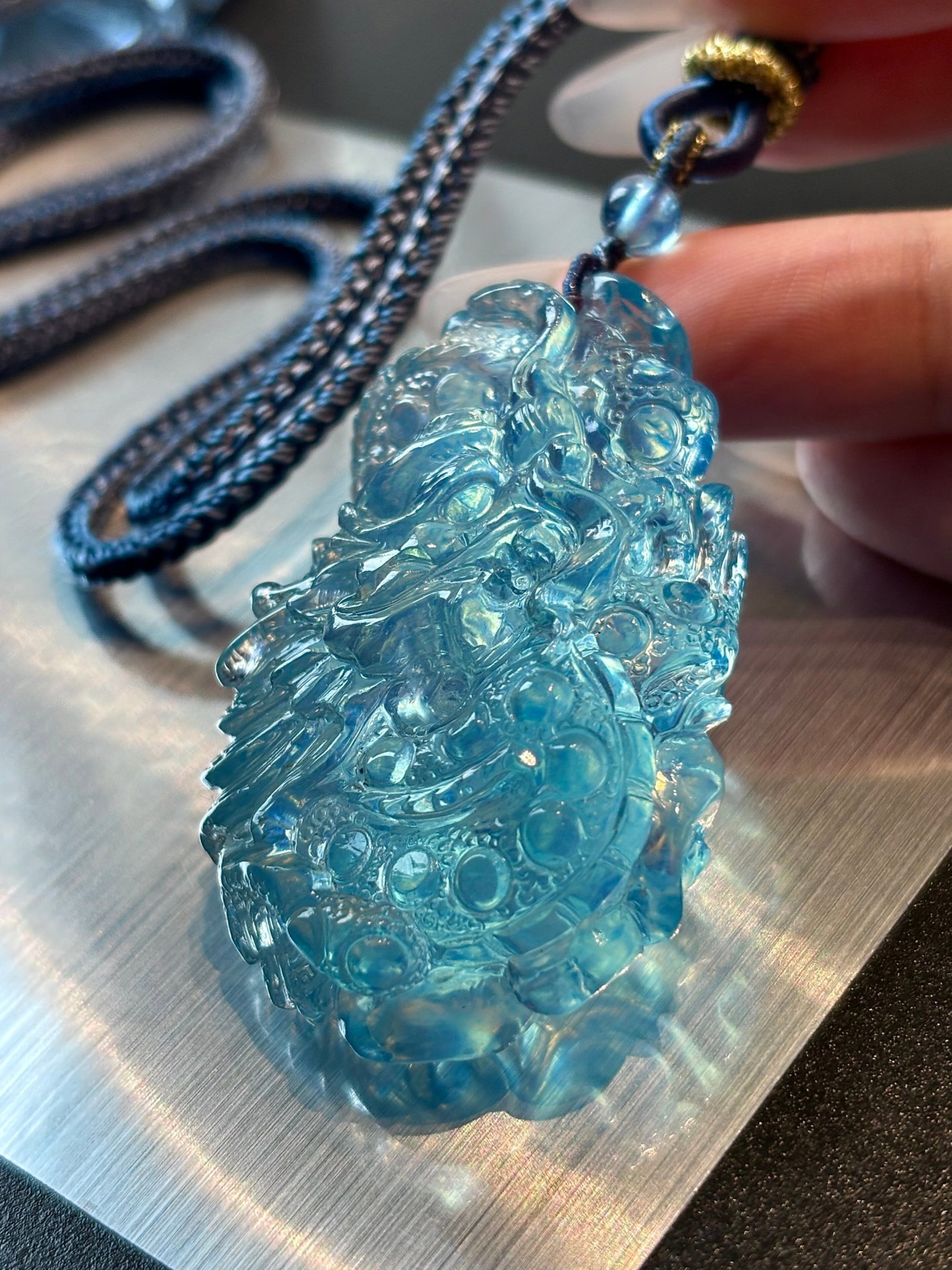 An Exquisite Aquamarine Dragon Pattern Pendant: Estimated Value:1800-3600 An Exquisite Aquamarine Dragon Pattern Pendant,Size:52mmx33mmx19mm,Weight:6.7g 海蓝宝龙纹吊坠