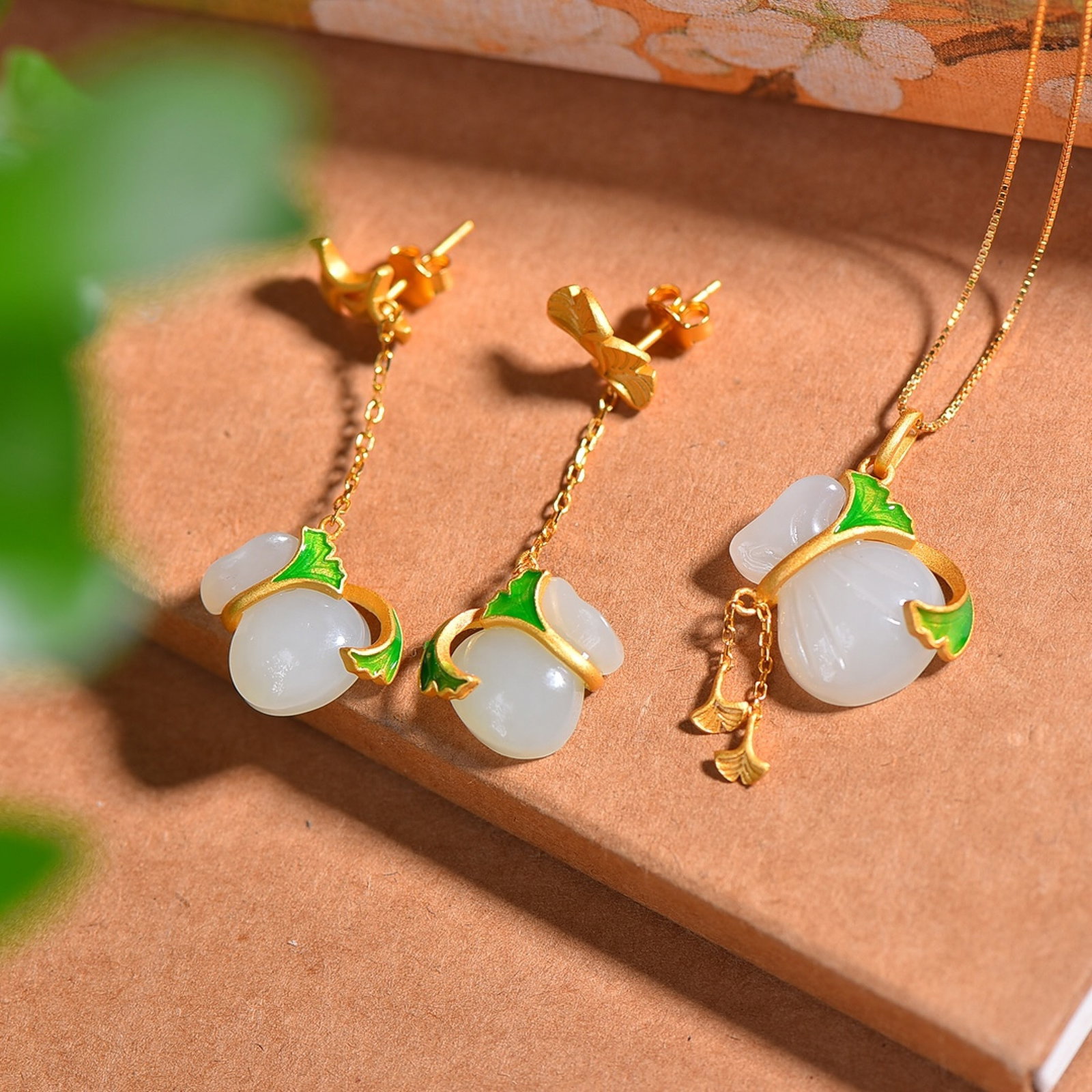 A Set of Fine Sterling Silver-Gold Plated Inlaid White Jade Enamel Jewelrys: Estimated Value:680-1360 A Set of Fine Sterling Silver-Gold Plated Inlaid White Jade Enamel Jewelrys,Size:(Earrings)11mmx13mm,(Pendant)14mmx18mm