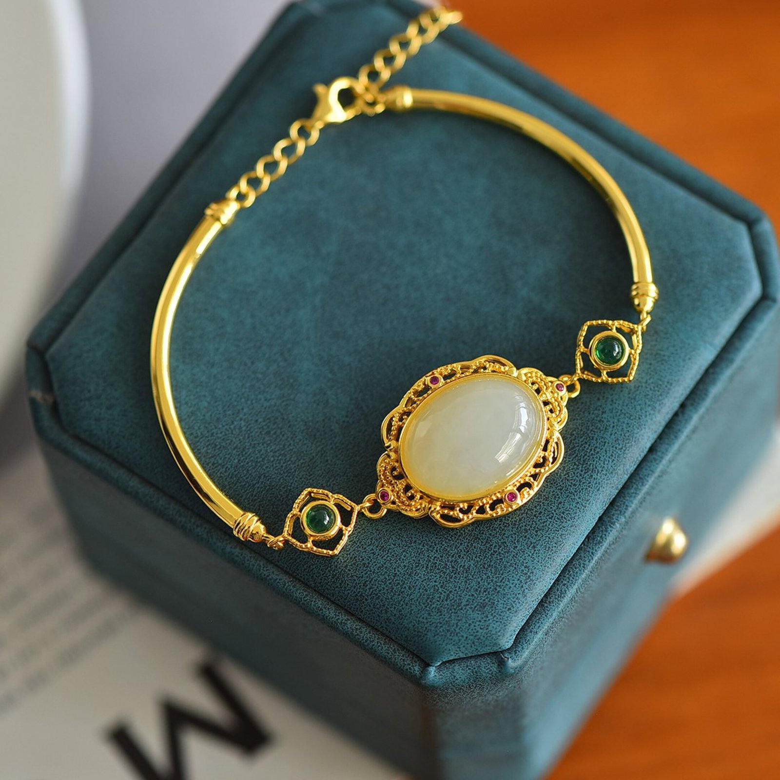 An Exquisite Sterling Silver-Gold Plated Inlaid White Jade Bracelet: Estimated Value:400-800 An Exquisite Sterling Silver-Gold Plated Inlaid White Jade Bracelet,Size:12mmx16mm 纯银镀金镶白玉手链