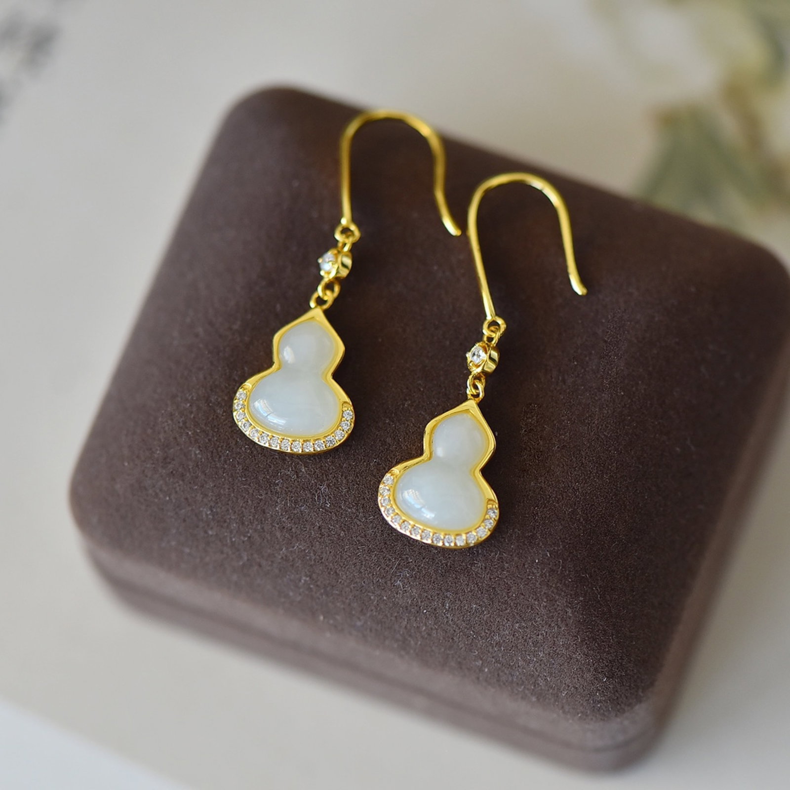 A Pair of Exquisite Sterling Silver-Gold Plated Inlaid White Jade Gourd Earrings,Inlaid Diamond: Estimated Value:300-600 A Pair of Exquisite Sterling Silver-Gold Plated Inlaid White Jade Gourd Earrings,Inlaid Diamond,Size:9mmx12mm