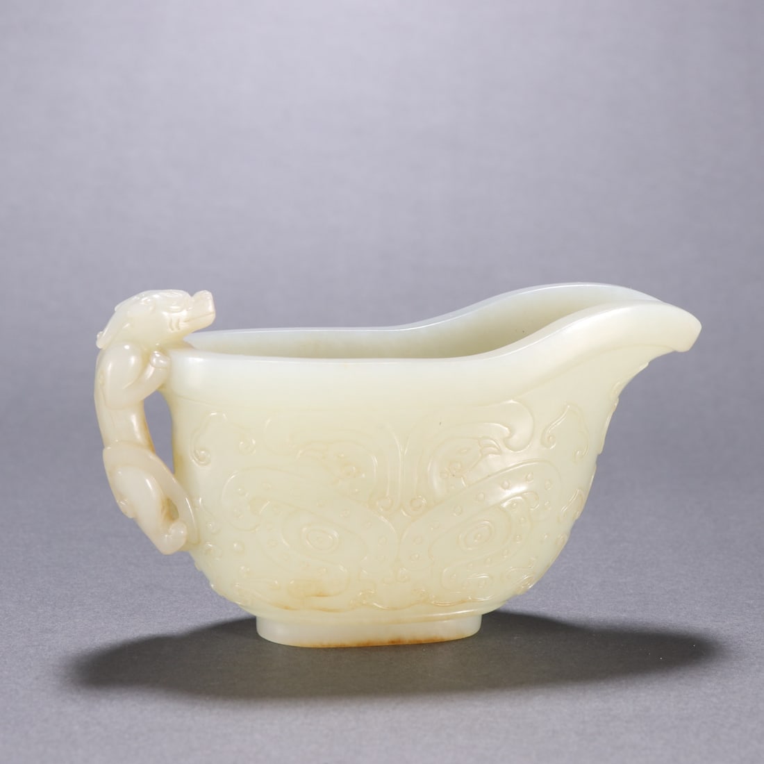 An Exquisite White Jade Beast-Face and Chi-Dragon Pattern Cup: Estimated Value:12000-24000 An Exquisite White Jade Beast-Face and Chi-Dragon Pattern Cup,Qing Dynasty, China,Size:2.5inx4.5in,Weight:240g