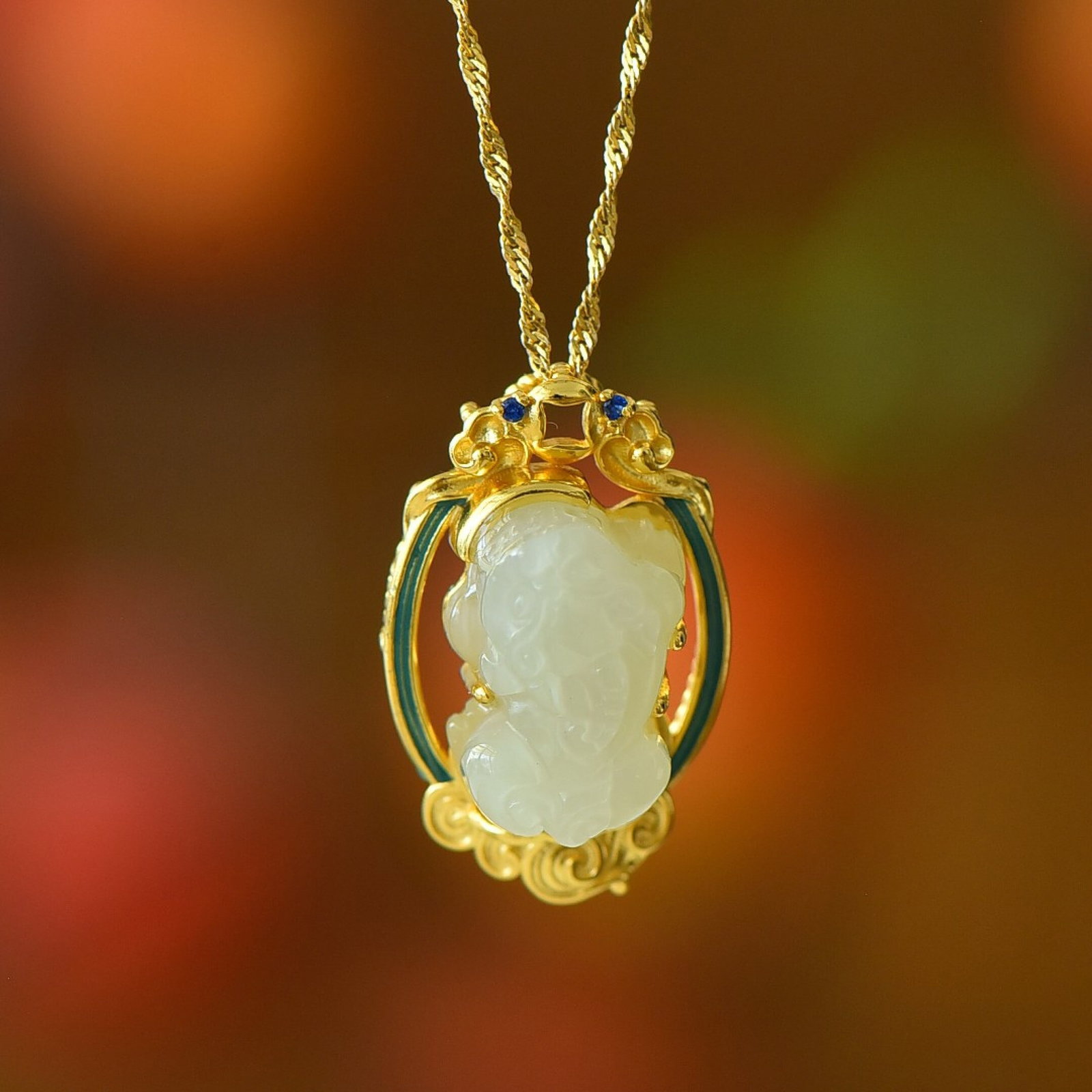 An Exquisite Sterling Silver-Gold Plated Inlaid White Jade Pendant: Estimated Value:300-600 An Exquisite Sterling Silver-Gold Plated Inlaid White Jade Pendant,Size:11mmx17mm 纯银镀金镶白玉吊坠