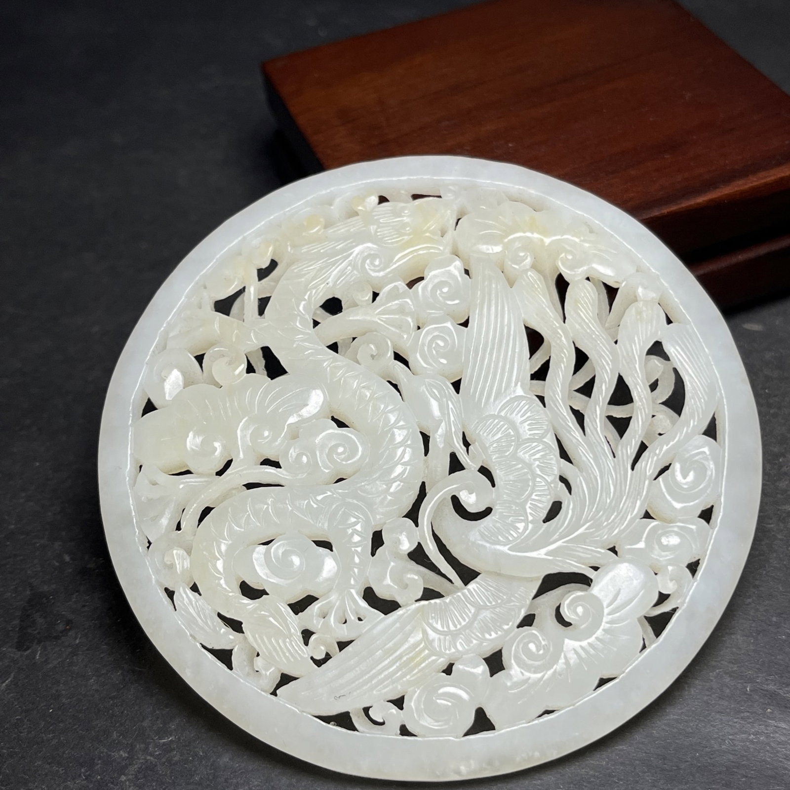 An Exquisite White Jade Auspicious Cloud,Dragon and Phoenix Pattern Pendant: Estimated Value:800-1600 An Exquisite White Jade Auspicious Cloud,Dragon and Phoenix Pattern Pendant,Qing Dynasty,China,Size:92mmx6mm,Weight:87g