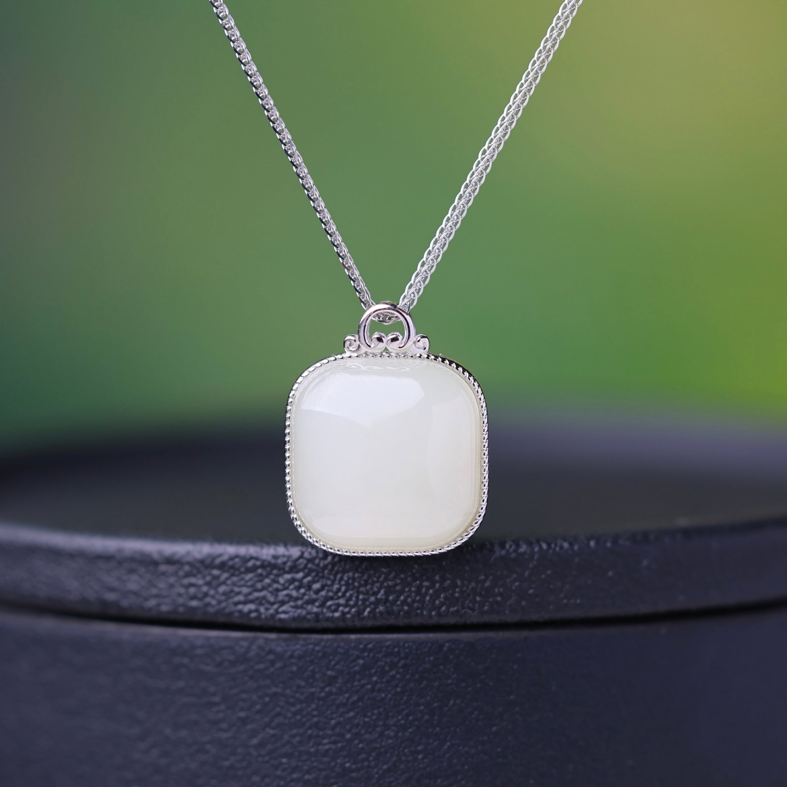 An Exquisite Sterling Silver Inlaid White Jade Pendant: Estimated Value:300-600 An Exquisite Sterling Silver Inlaid White Jade Pendant,Size:14mmx14mm 纯银镶白玉吊坠