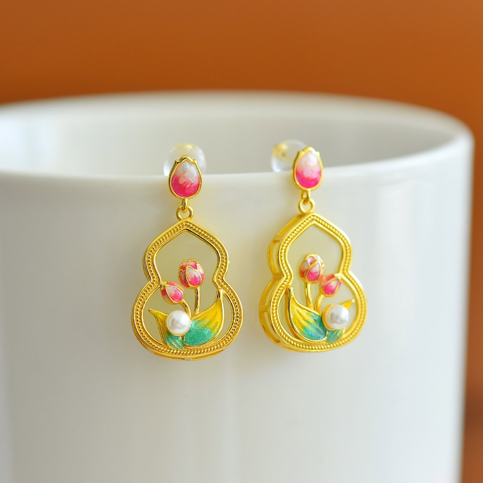 A Pair of Exquisite Sterling Silver-Gold Plated Inlaid White Jade Enamel Gourd Earrings,Inlaid Pe...: Estimated Value:300-600 A Pair of Exquisite Sterling Silver-Gold Plated Inlaid White Jade Enamel Gourd Earrings,Inlaid Pearls,Size:13mmx17mm