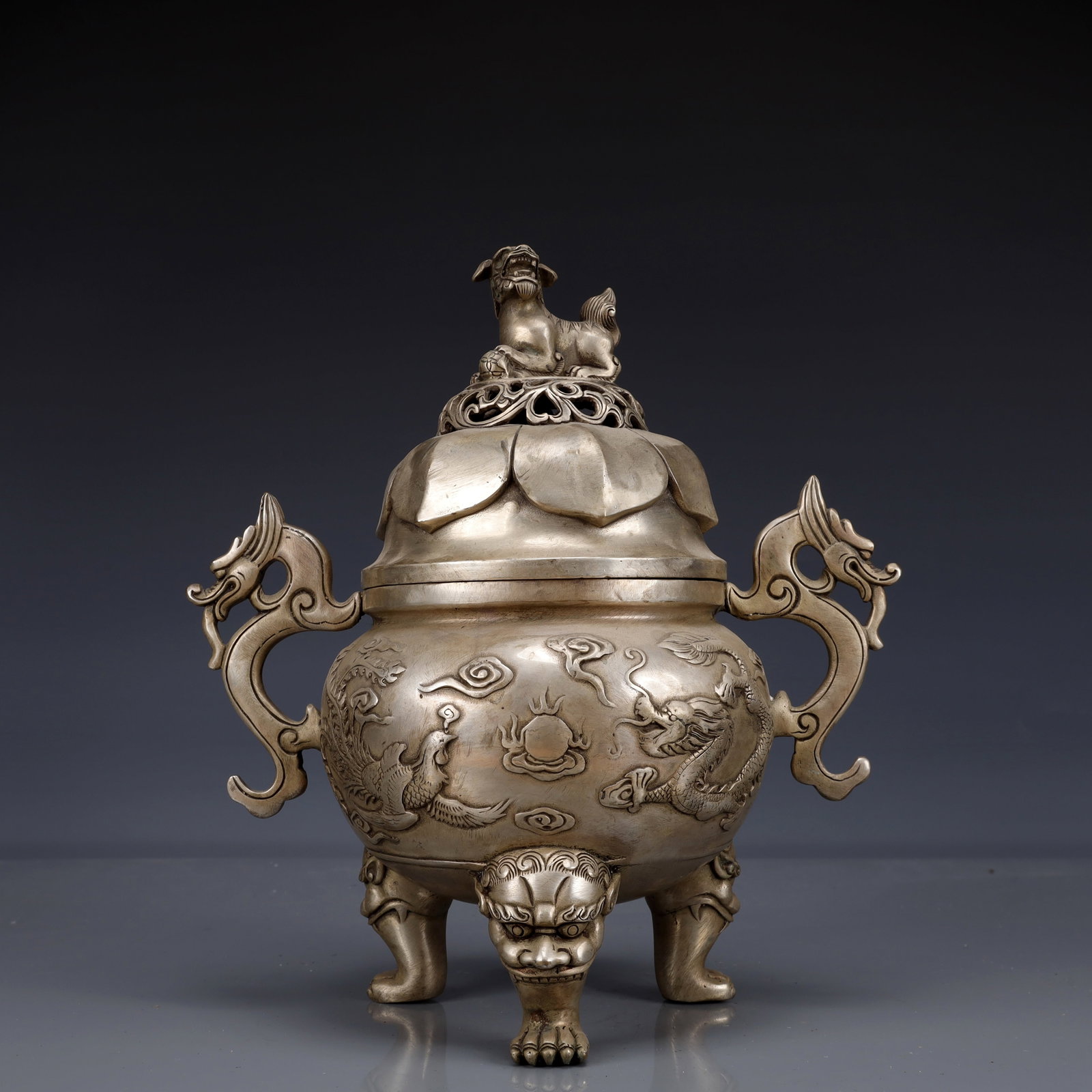An Exquisite Silver-Plated Bronze Dragon and Phoenix Pattern Dragon-Ears Tripod Censer: Estimated Value:1800-3600 An Exquisite Silver-Plated Bronze Dragon and Phoenix Pattern Dragon-Ears Tripod Censer,Qing Dynasty, China,Qianlong Four-character Mark,Size:9.1inx5.9inx10.6in,Weight:1850g