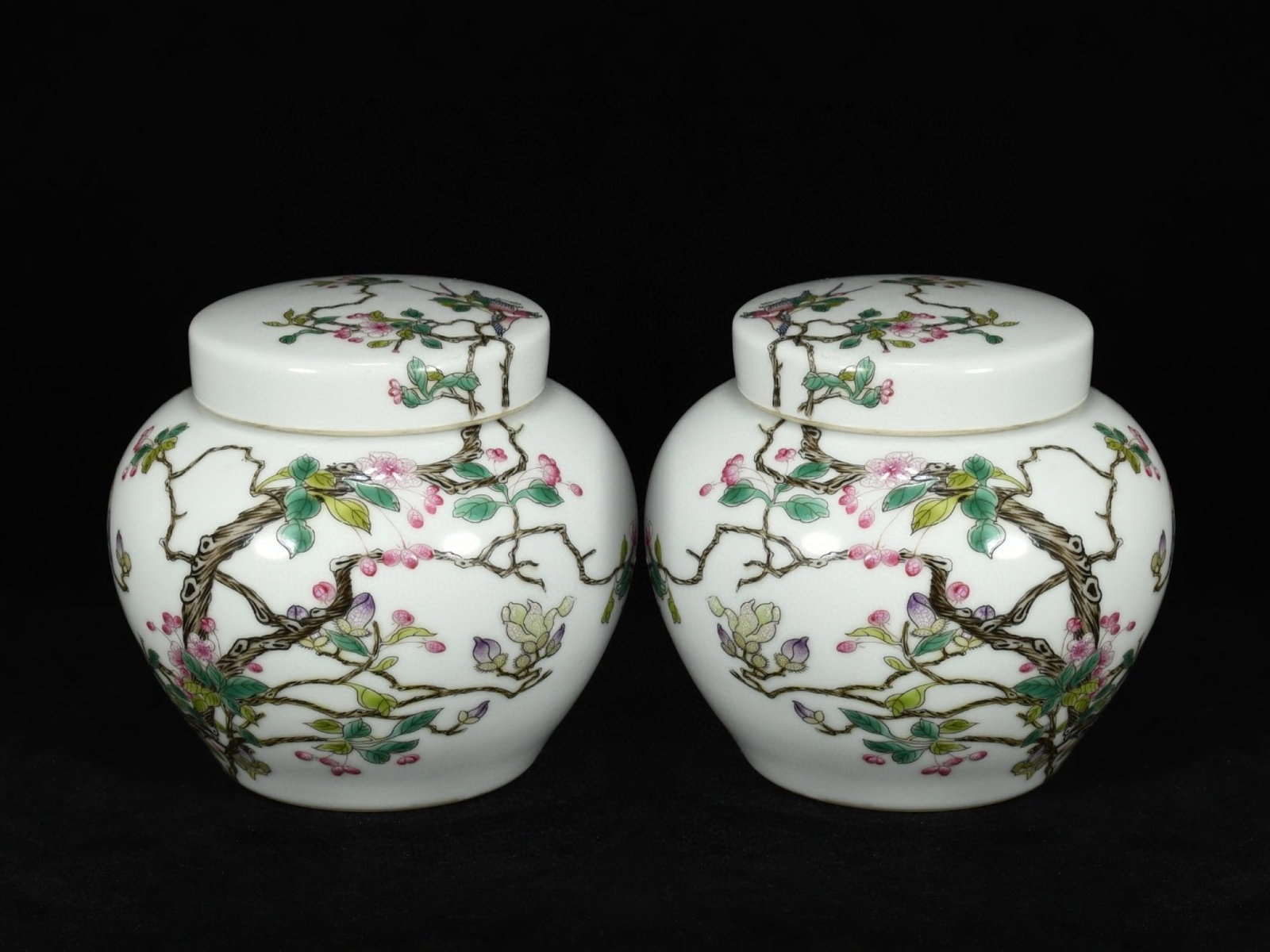 A Pair of Exquisite Famille-Rose Flower and Bird Pattern Cover Jars: Estimated Value:3200-6400 A Pair of Exquisite Famille-Rose Flower and Bird Pattern Cover Jars,Qing Dynasty,China,Yongzheng Four-character Mark,Size:5.9inx5.9in
