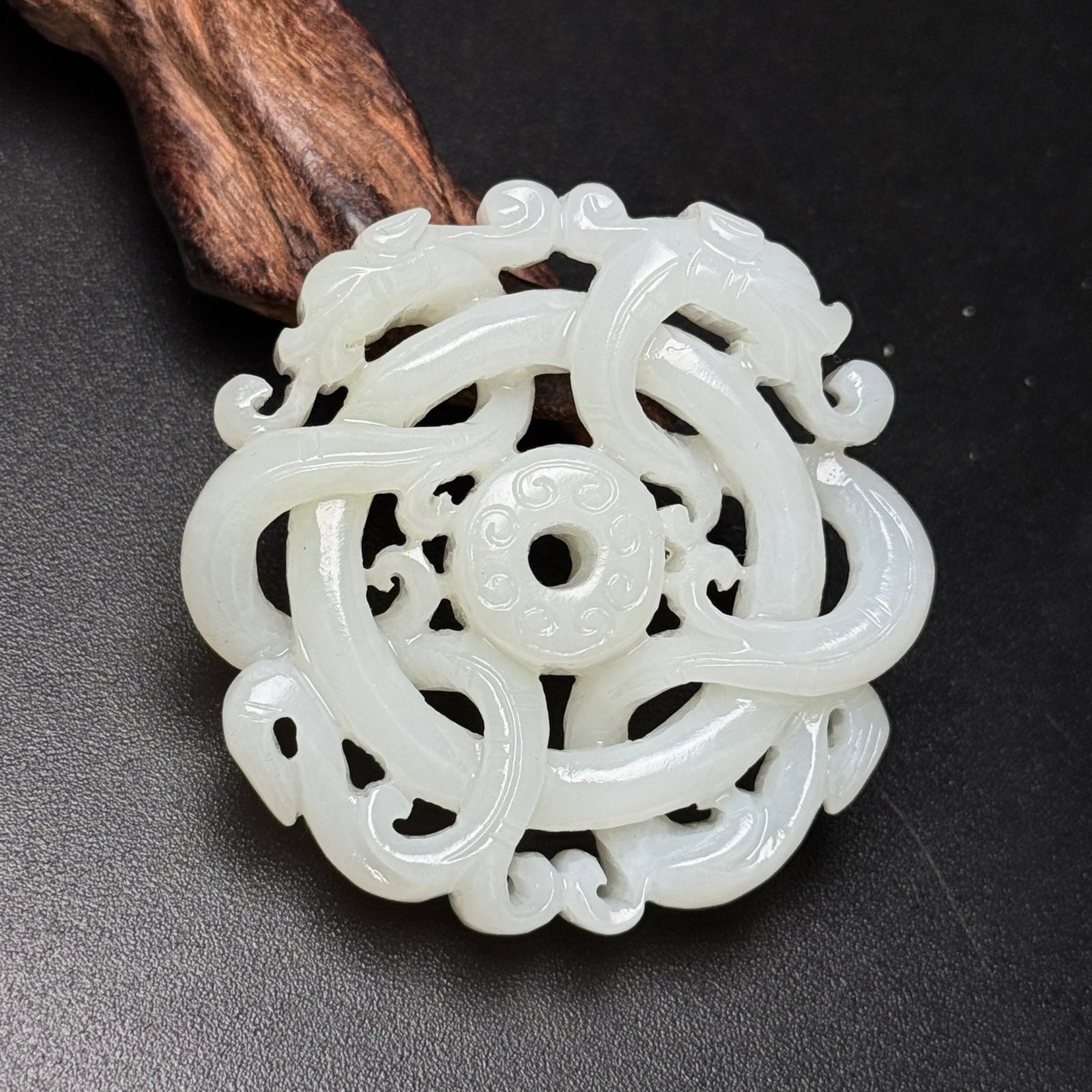 An Exquisite White Jade Dragon Pendant: Estimated Value:960-2000 An Exquisite White Jade Dragon Pendant,Qing Dynasty,China,Size:55mmx55mmx12mm,Weight:44g 白玉龙挂件,中国清代