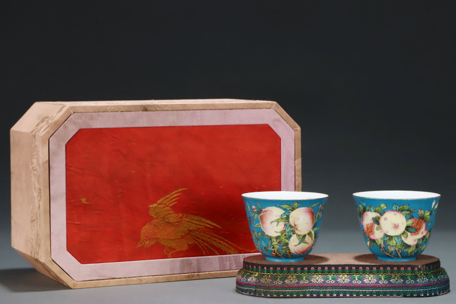 A Pair of Exquisite Blue Glazed Famille-Rose Flower and Fruit Pattern Cups: Estimated Value:1900-3800 A Pair of Exquisite Blue Glazed Famille-Rose Flower and Fruit Pattern Cups,Qing Dynasty,China,Yongzheng Six-character Mark,Size:2.6inx3.3in