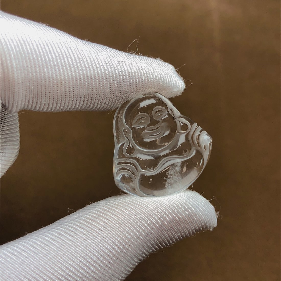 An Exquisite Crystal Maitreya Buddha Pendant: Estimated Value:400-800 An Exquisite Crystal Maitreya Buddha Pendant,Size:24.1mmx23.5mmx7.6mm,Weight:7.8g 水晶弥勒佛吊坠