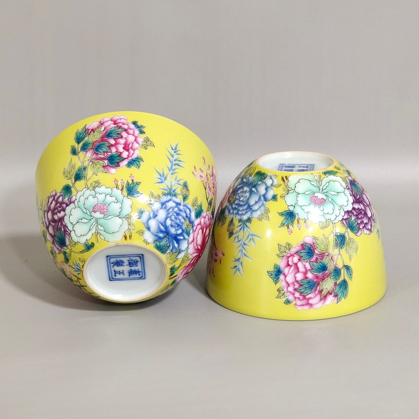 A Pair of Exquisite Yellow Glazed Famille-Rose Peony Pattern Cups: Estimated Value:2400-4800 A Pair of Exquisite Yellow Glazed Famille-Rose Peony Pattern Cups,Qing Dynasty,China,Yongzheng Four-character Mark,Size:2inx2.9in