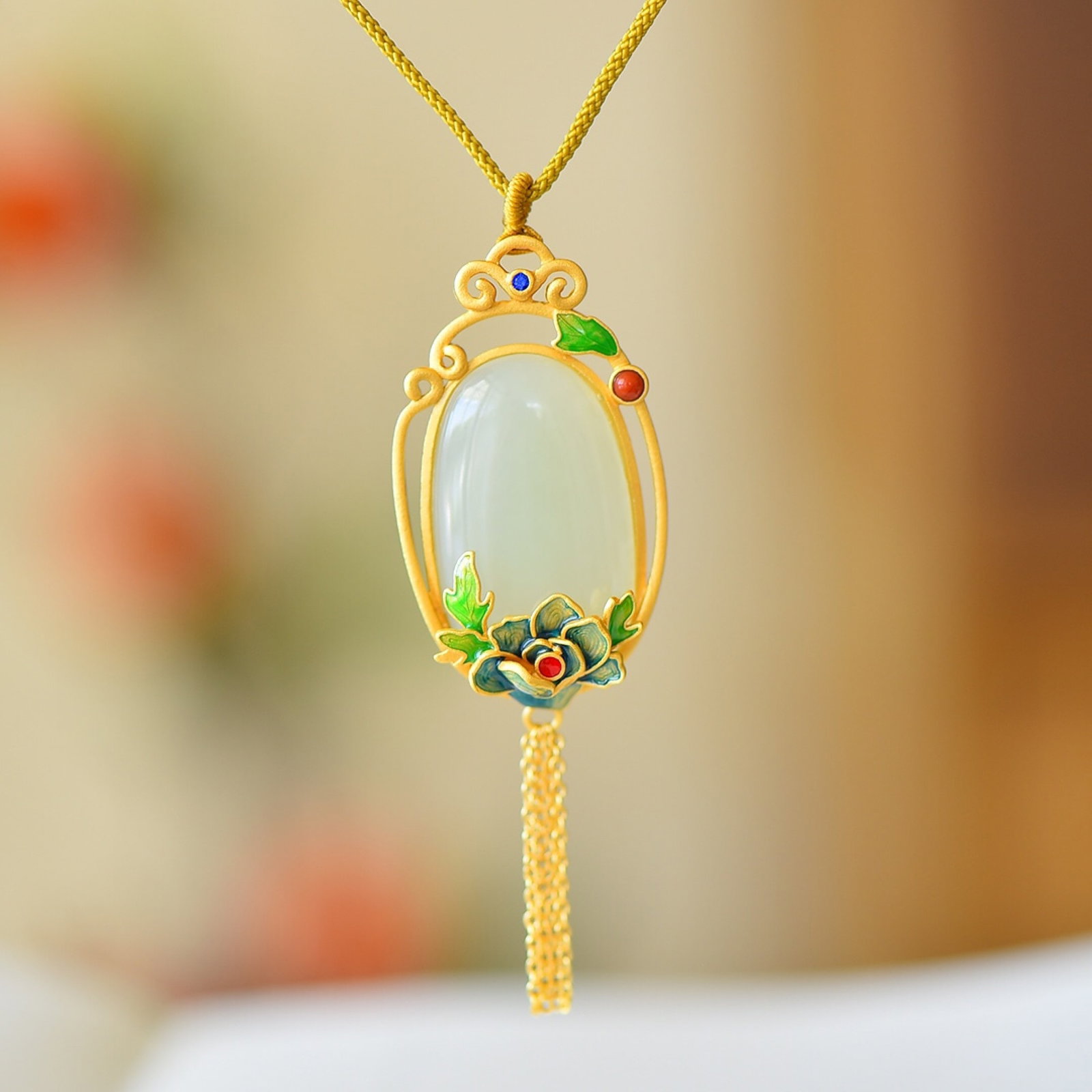 An Exquisite Sterling Silver-Gold Plated Inlaid White Jade Enamel Pendant: Estimated Value:400-800 An Exquisite Sterling Silver-Gold Plated Inlaid White Jade Enamel Pendant,Size:20mmx30mm 纯银镀金镶白玉珐琅吊坠