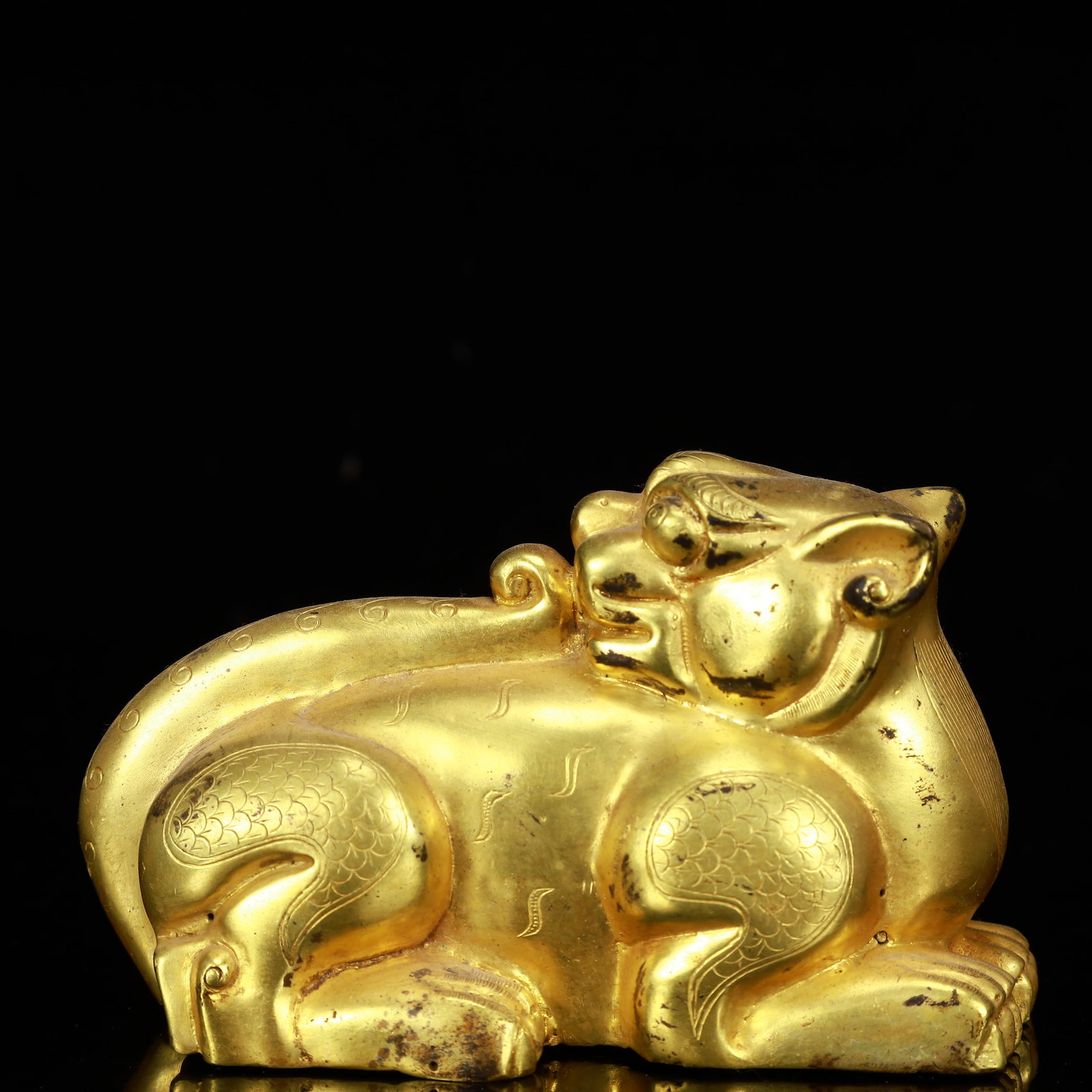 A Rare Gilt Bronze Lion Ornament: Estimated Value:1400-2800 A Rare Gilt Bronze Lion Ornament,The Warring States period in China,Size:4.7inx2.4inx2.8in,Weight:450g