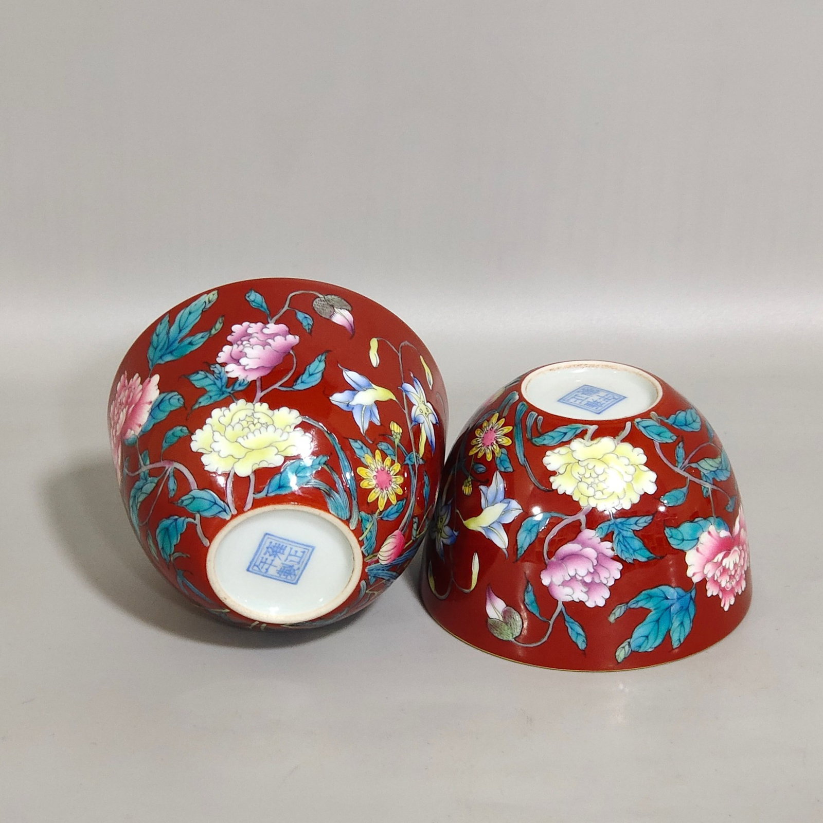 A Pair of Exquisite Enamel Red Glazed Flower Pattern Cups: Estimated Value:2400-4800 A Pair of Exquisite Enamel Red Glazed Flower Pattern Cups,Qing Dynasty,China,Yongzheng Four-character Mark,Size:1.9inx2.8in 一对珐琅彩红&#