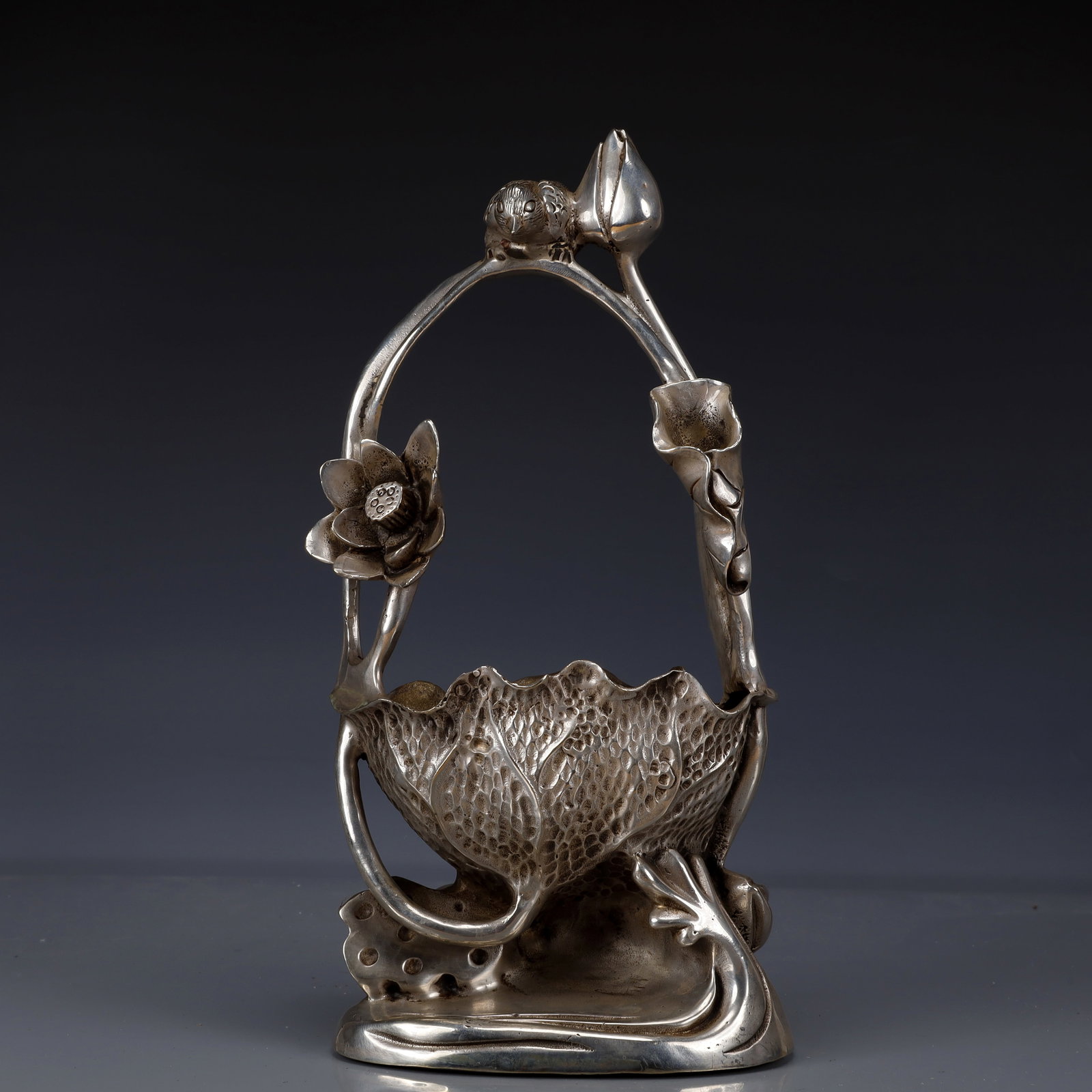 An Exquisite Silver-Plated Bronze Lotus Pattern Washer: Estimated Value:1800-3600 An Exquisite Silver-Plated Bronze Lotus Pattern Washer,Qing Dynasty, China,Qianlong Four-character Mark,Size:7.5inx3.5inx12.6in,Weight:2300g