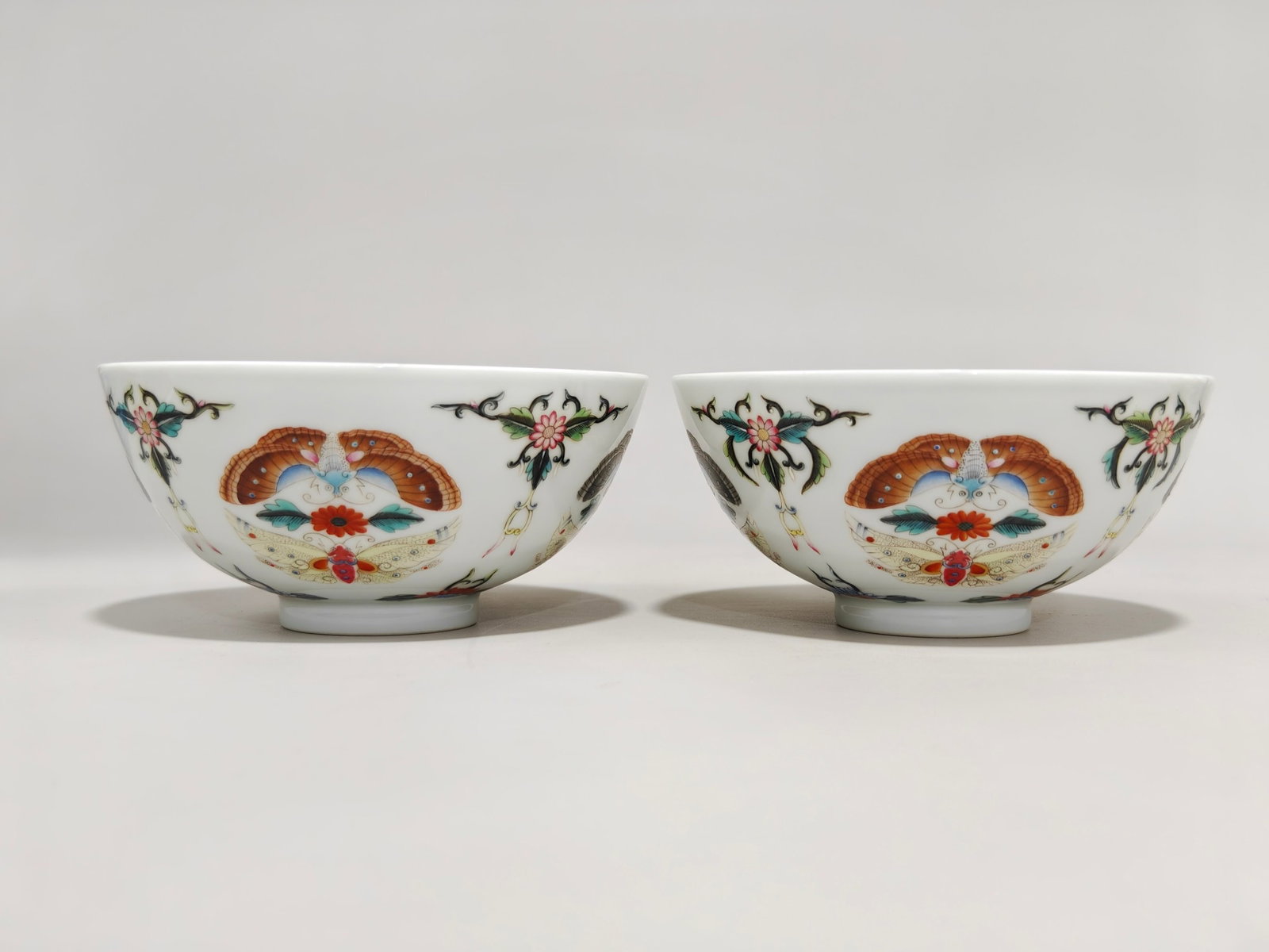 A Pair of Exquisite Famille-Rose Butterfly Pattern Bowls: Estimated Value:3000-6000 A Pair of Exquisite Famille-Rose Butterfly Pattern Bowls,Qing Dynasty,China,Yongzheng Six-character Mark,Size:2.6inx5.6in