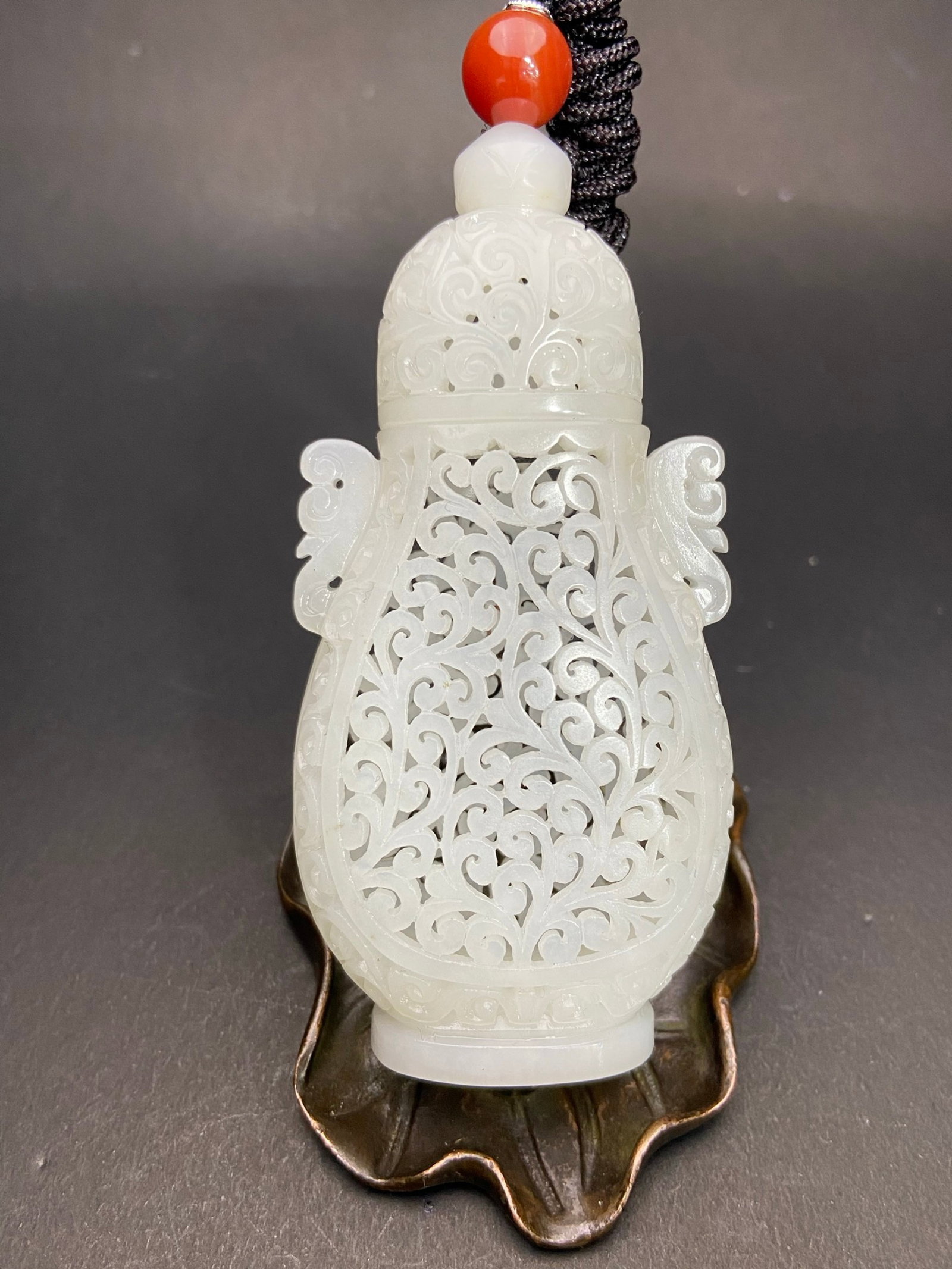 An Exquisite White Jade Hollow Double-Ears Snuff Bottle: Estimated Value:1000-2000 An Exquisite White Jade Hollow Double-Ears Snuff Bottle,Qing Dynasty,China,Size:100mmx48.5mmx25.4mm,Weight:78g