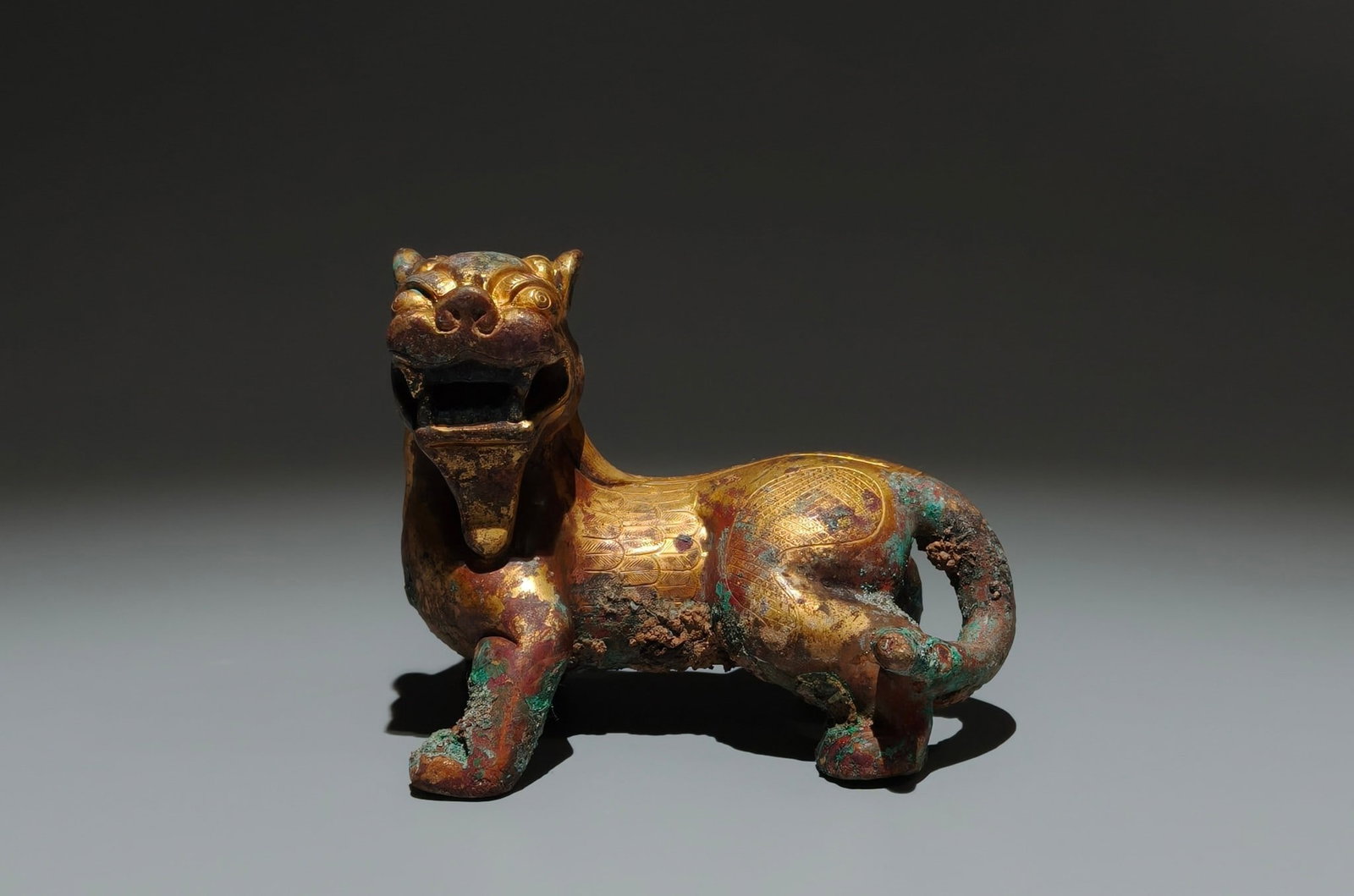 An Exquisite Gilt Bronze Auspicious Beast Ornament: Estimated Value:1500-3000 An Exquisite Gilt Bronze Auspicious Beast Ornament,Tang Dynasty,China,Size:3.7inx4.7inx3in