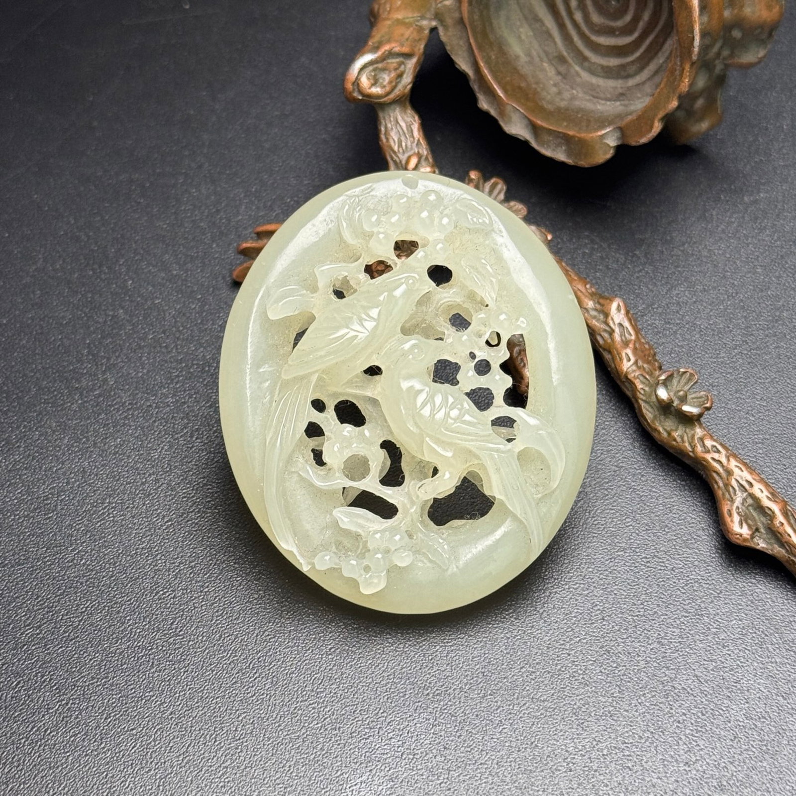 An Exquisite White Jade Flower and Bird Pattern Pendant: Estimated Value:650-1300 An Exquisite White Jade Flower and Bird Pattern Pendant,Qing Dynasty,China,Size:44mmx52mmx11mm,Weight:27g