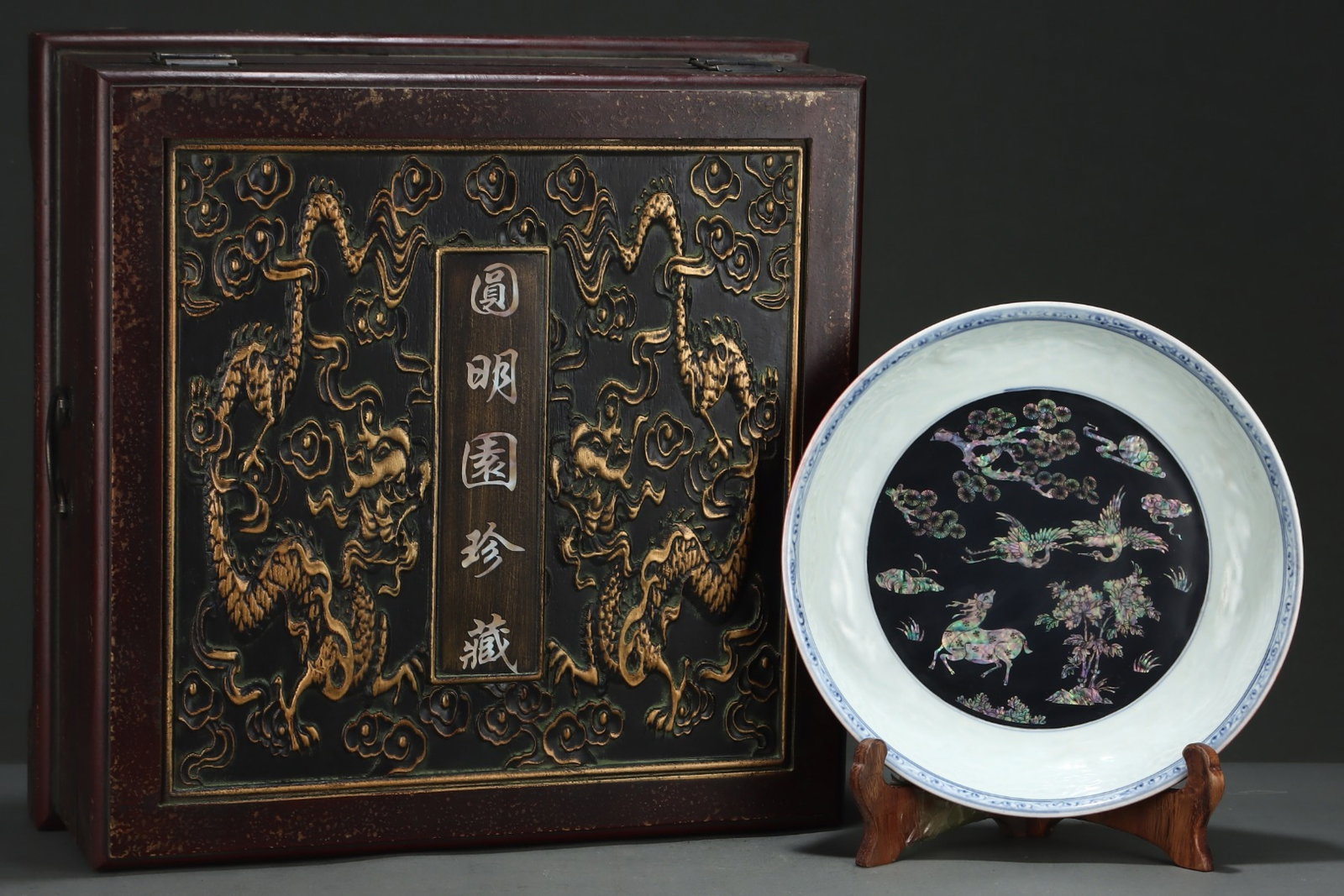 A Rare Ji Red Glazed Blue and White Deer Crane and Dragon Pattern Plate,Inlaid Mother-of-pearl-in...: Estimated Value:2400-4800 A Rare Ji Red Glazed Blue and White Deer Crane and Dragon Pattern Plate,Inlaid Mother-of-pearl-inlay,Yuan Dynasty,China,Size:2.6inx12.4in