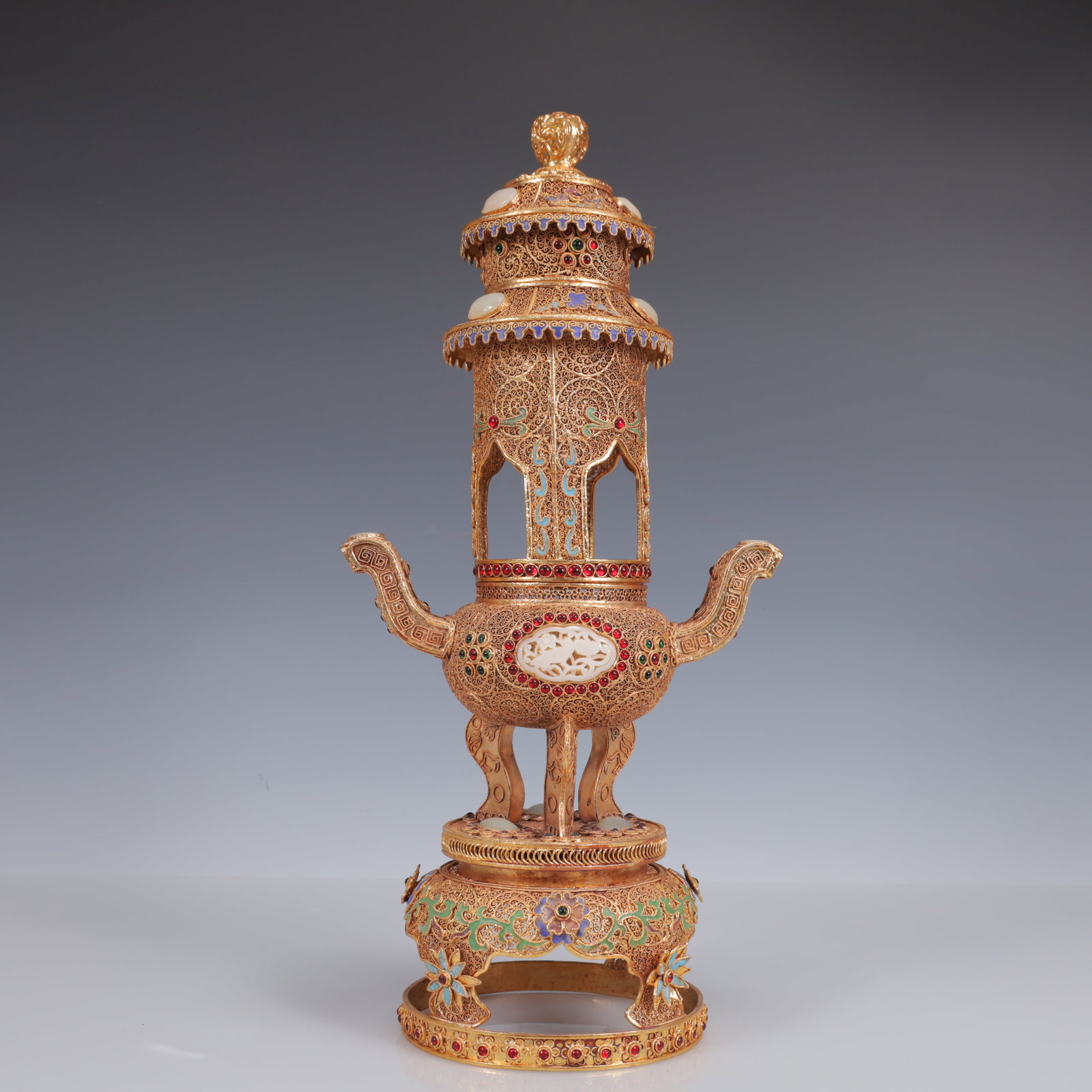 An Exquisite Filigree and Gilding Inlaid White Jade Double-Ears and Tripod Censer,Inlaid Gems: Estimated Value:4800-9600 An Exquisite Filigree and Gilding Inlaid White Jade Double-Ears and Tripod Censer,Inlaid Gems,Qing Dynasty, China,Qianlong Four-Character