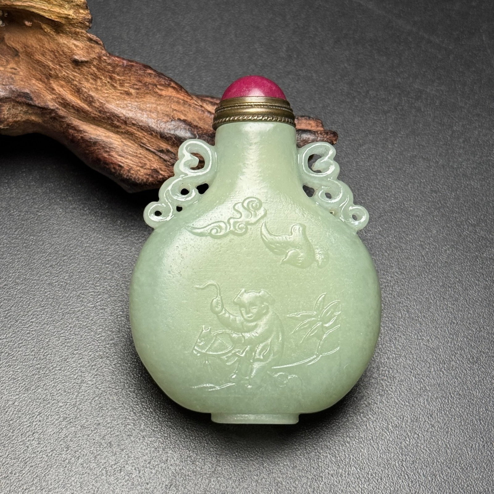 An Exquisite White Jade Flower and Figure Pattern Double-Ears Snuff Bottle: Estimated Value:720-1500 An Exquisite White Jade Flower and Figure Pattern Double-Ears Snuff Bottle,Qing Dynasty,China,Size:61mmx44mmx16mm,Weight:57g