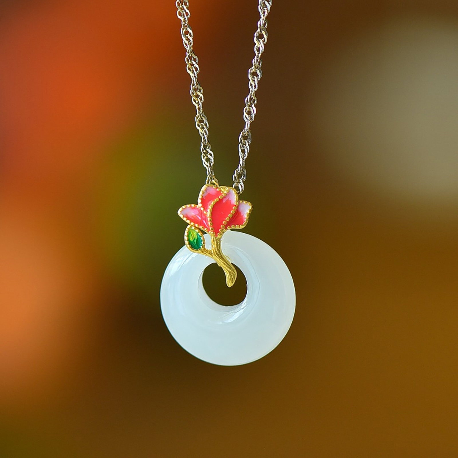 An Exquisite Sterling Silver-Gold Plated Inlaid White Jade Pendant: Estimated Value:200-400 An Exquisite Sterling Silver-Gold Plated Inlaid White Jade Pendant,Size:15mmx15mm 纯银镀金镶白玉吊坠