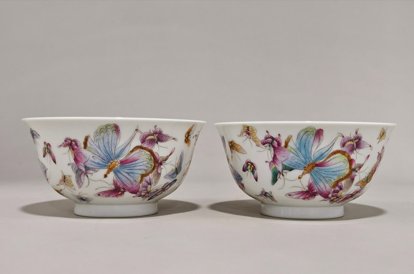 A Pair of Exquisite Famille-Rose Butterfly Pattern Bowls: Estimated Value:3000-6000 A Pair of Exquisite Famille-Rose Butterfly Pattern Bowls,Qing Dynasty,China,Daoguang Six-character Mark,Size:2.6inx5in