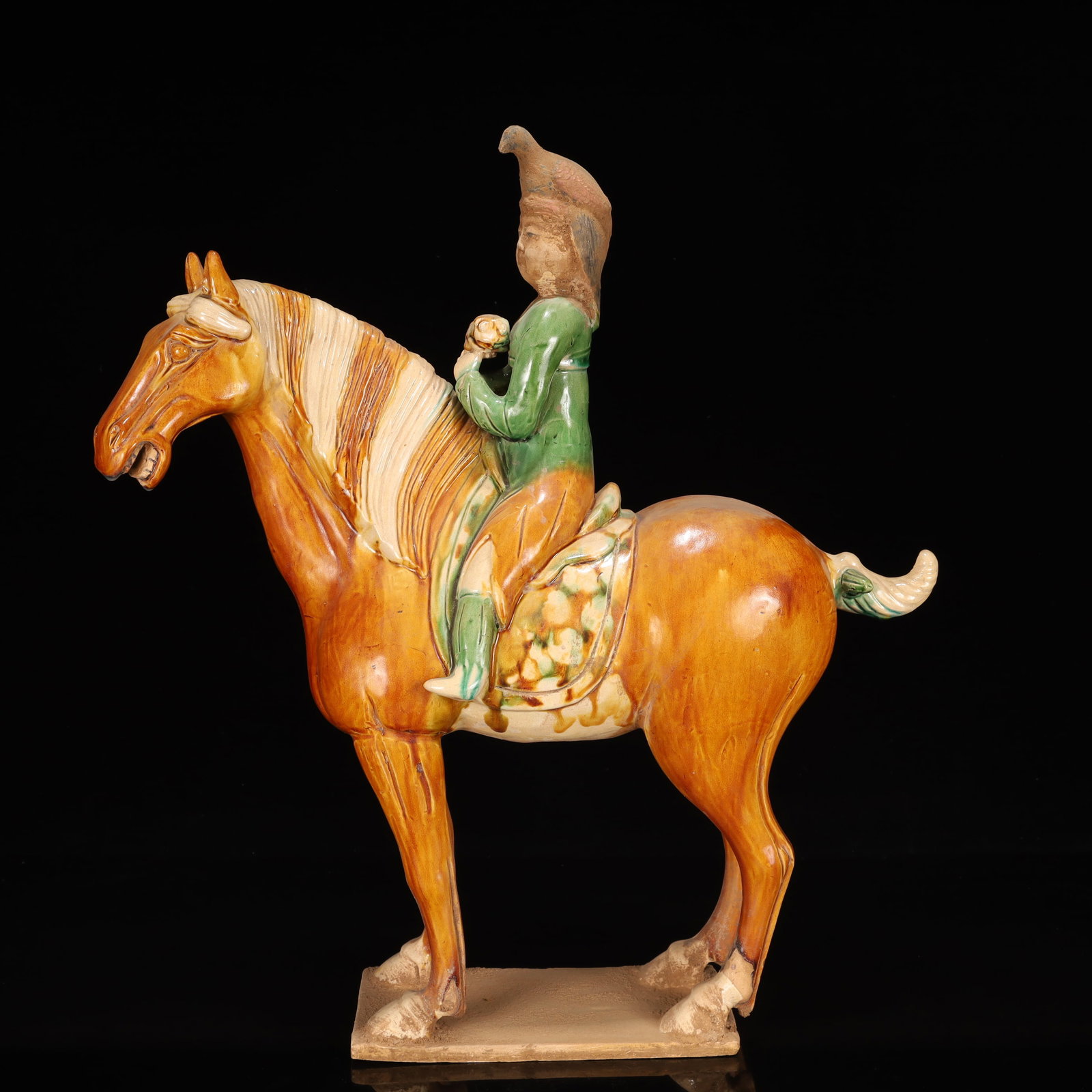 A Rare Tang Tri-Color Glazed Pottery Figure Riding Horse Ornament: Estimated Value:6500-13000 A Rare Tang Tri-Color Glazed Pottery Figure Riding Horse Ornament,Tang Dynasty, China,Chinese Tang Tri-colored Pottery, or Tang Sancai, flourished during the Tang Dynasty (6