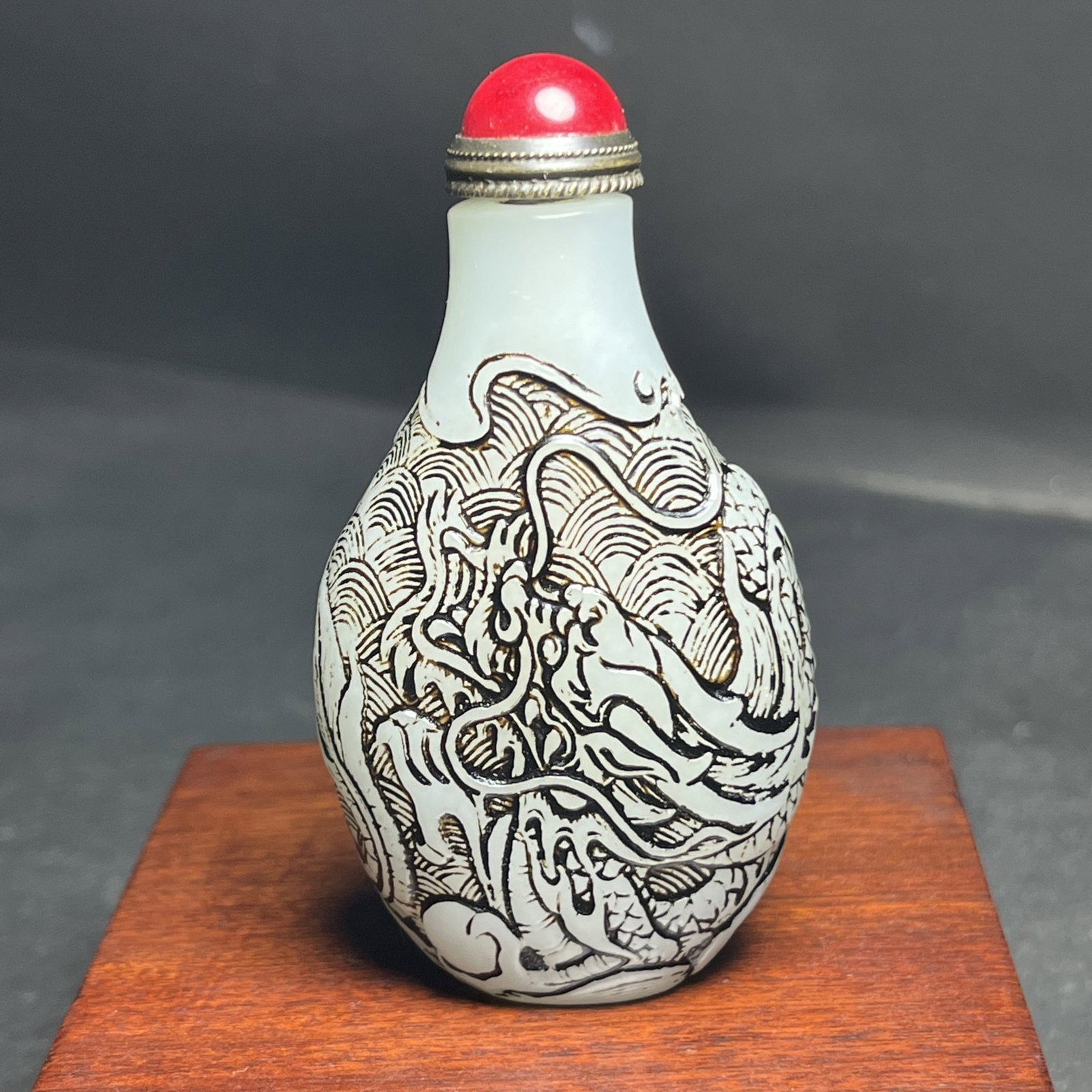 An Exquisite White Jade Seawater Dragon Pattern Snuff Bottle: Estimated Value:1600-3200 An Exquisite White Jade Seawater Dragon Pattern Snuff Bottle,Qing Dynasty,China,Size:66mmx20mmx41mm,Weight:62g