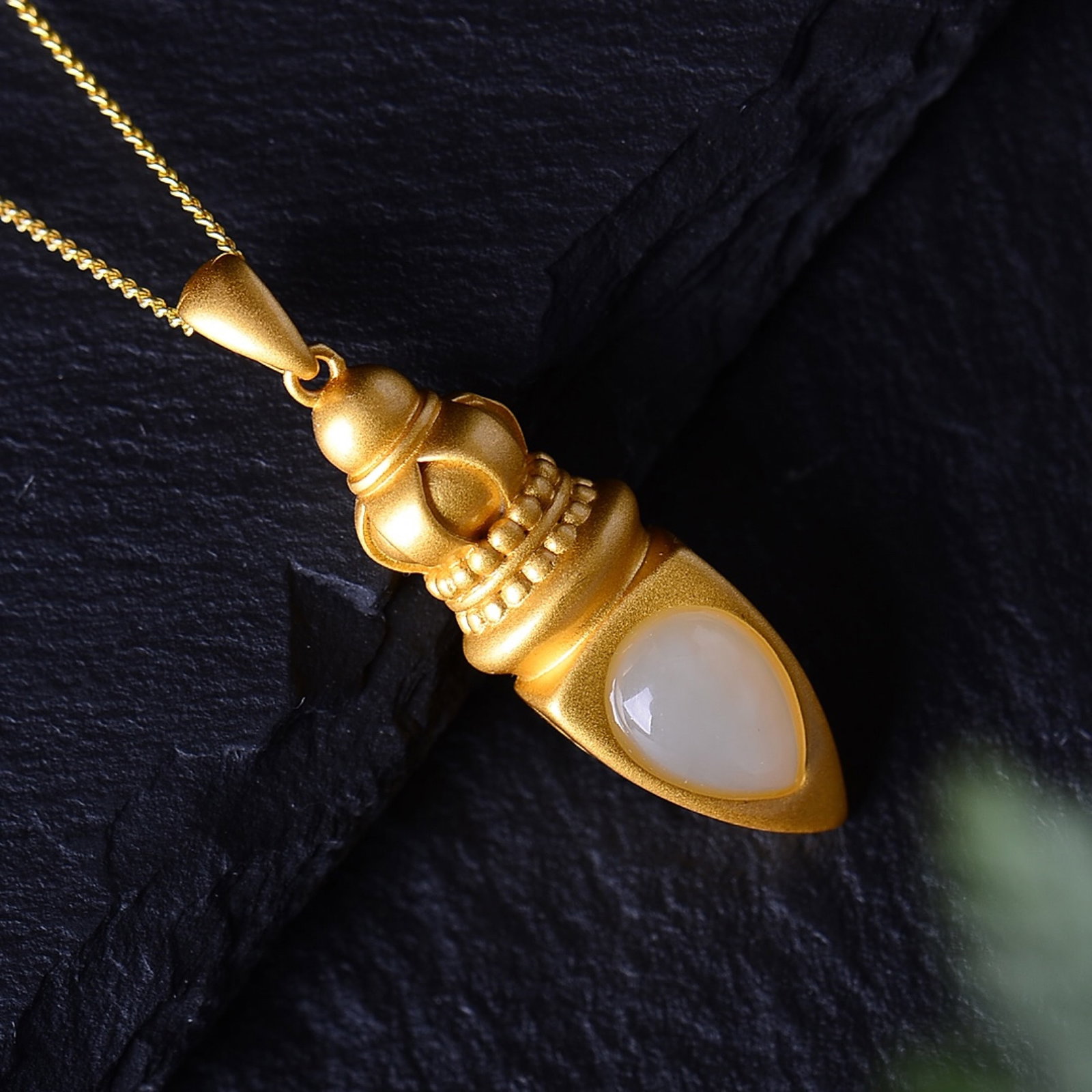 An Exquisite Sterling Silver-Gold Plated Inlaid White Jade Pendant: Estimated Value:200-400 An Exquisite Sterling Silver-Gold Plated Inlaid White Jade Pendant,Size:7mmx10mm 纯银镀金镶白玉吊坠