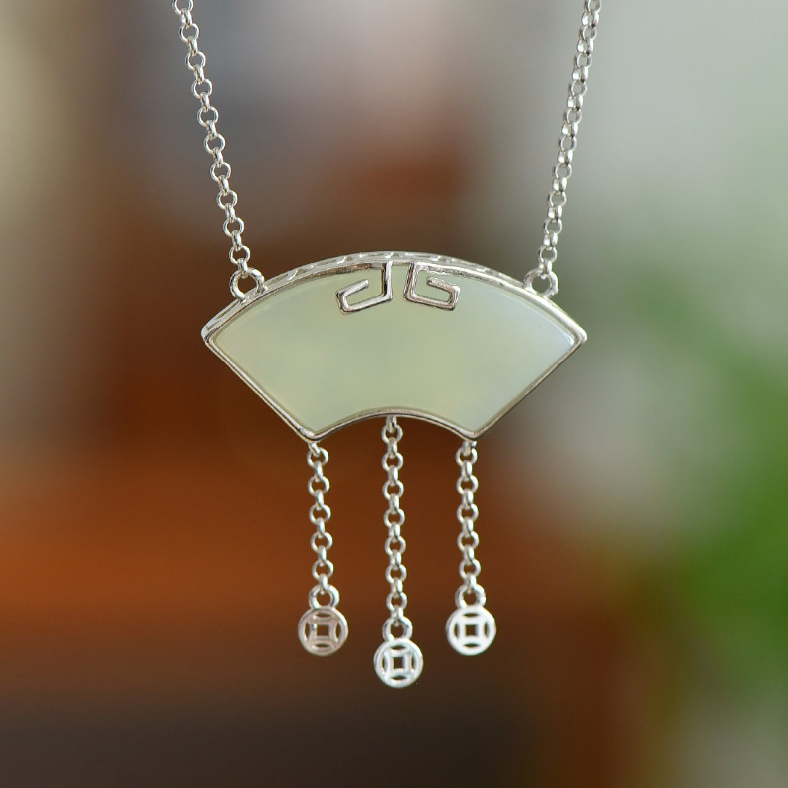 An Exquisite Sterling Silver Inlaid White Jade Pendant: Estimated Value:520-1040 An Exquisite Sterling Silver Inlaid White Jade Pendant,Size:16mmx35mm 纯银镶白玉吊坠